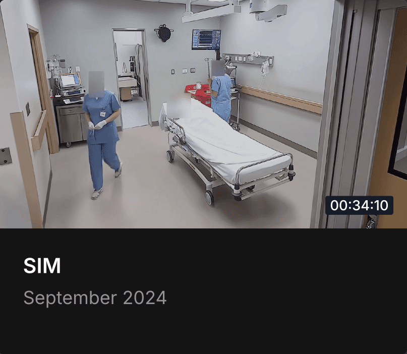 Two people walking through a trauma bay