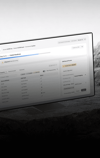 Three professionals in a modern office hallway engaged in a discussion, showcasing a collaborative and professional atmosphere.