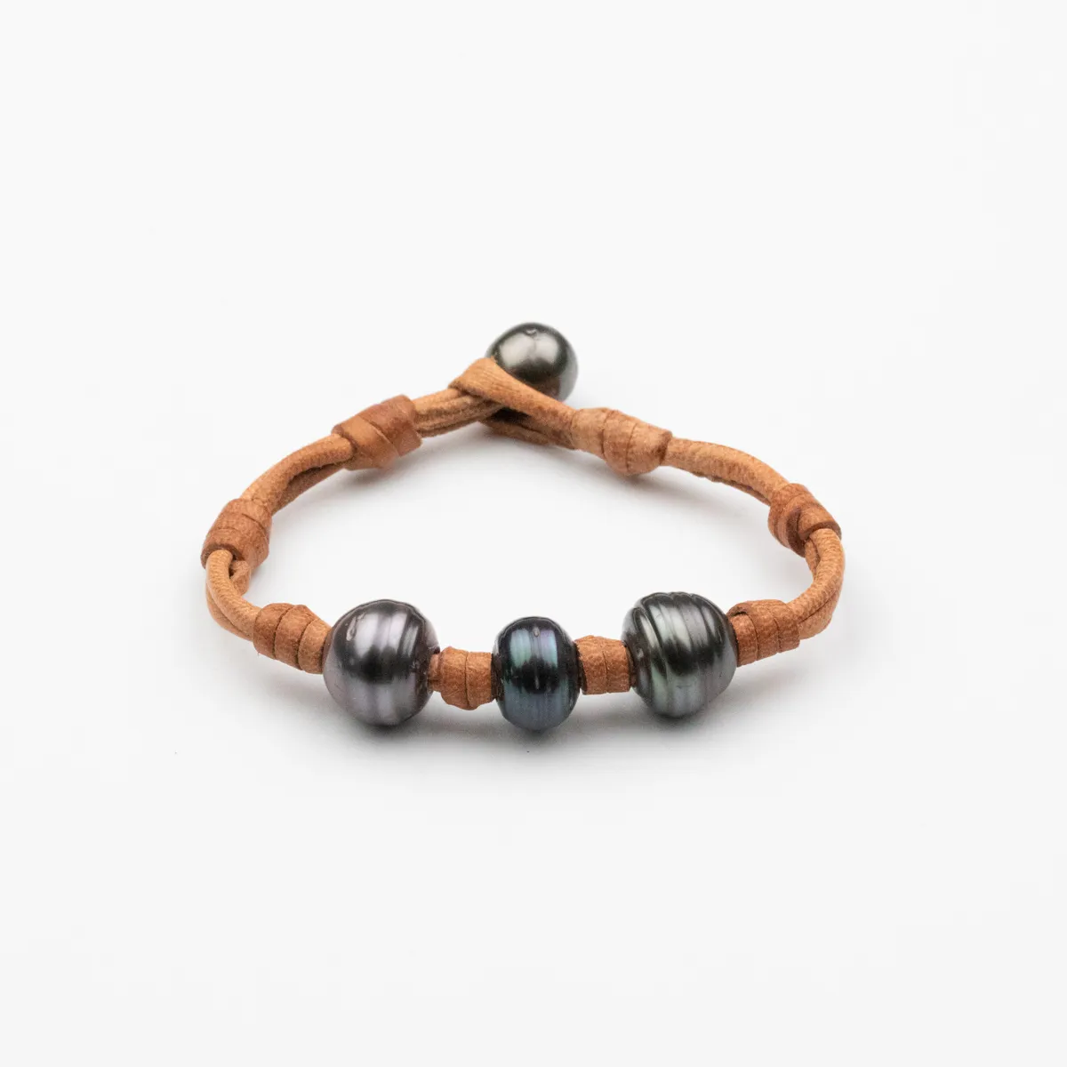 Tahitian Pearl leather bracelet with three baroque circle pearls and round pearl toggle closure on natural caramel leather cord — Manos de Oro Saint Barth