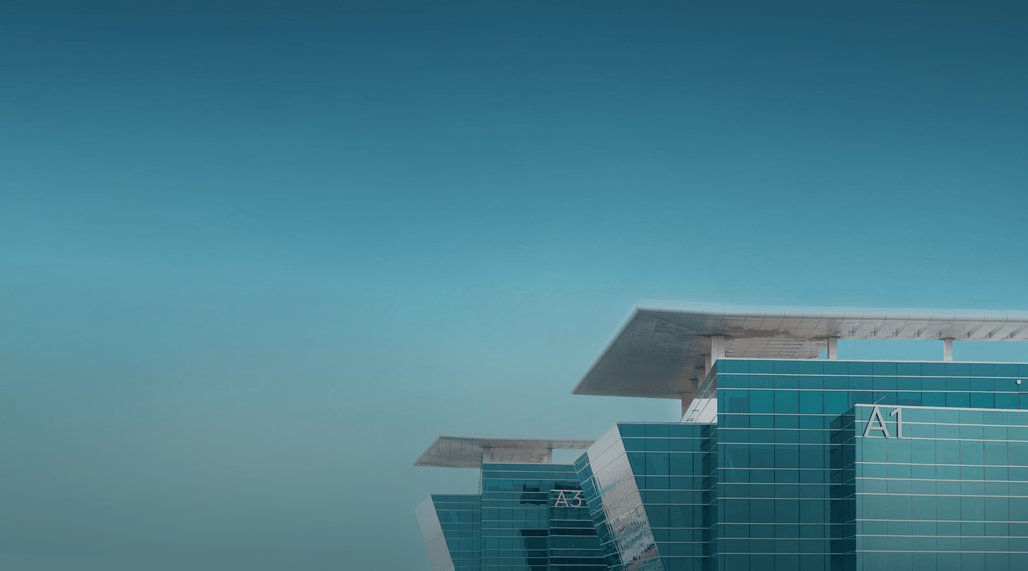 Dubai South Business Hub Free Zone - Modern office buildings with reflective glass