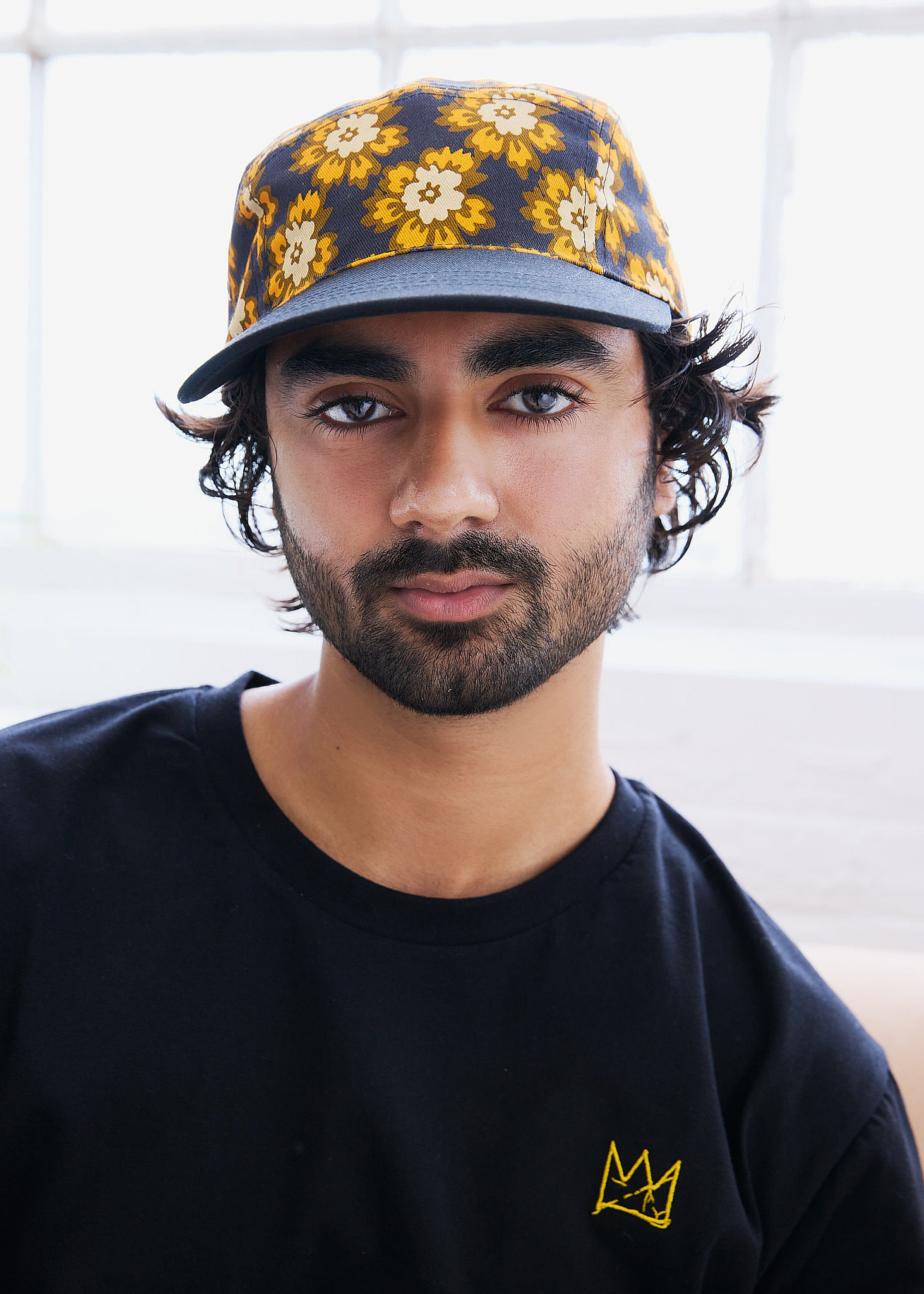 Woman walking on a curved pavement with shadow.