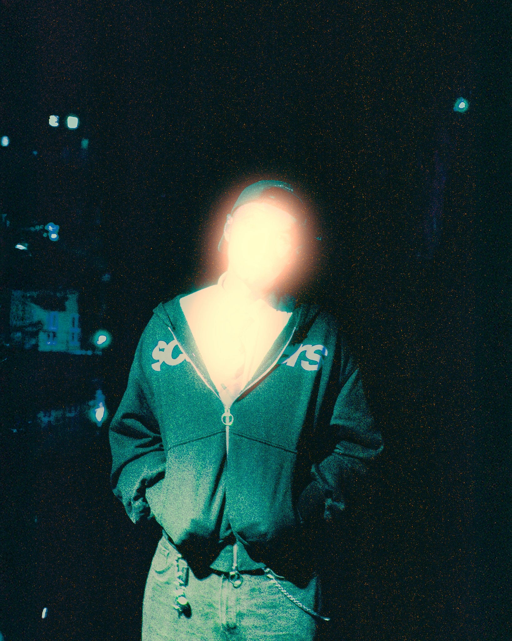 Woman with red hair covering mouth with hair