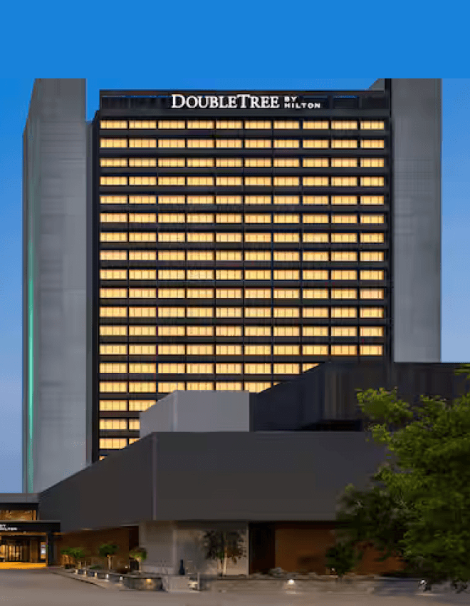 Man in VR headset interacts with green holographic code displayed on a curved screen.
