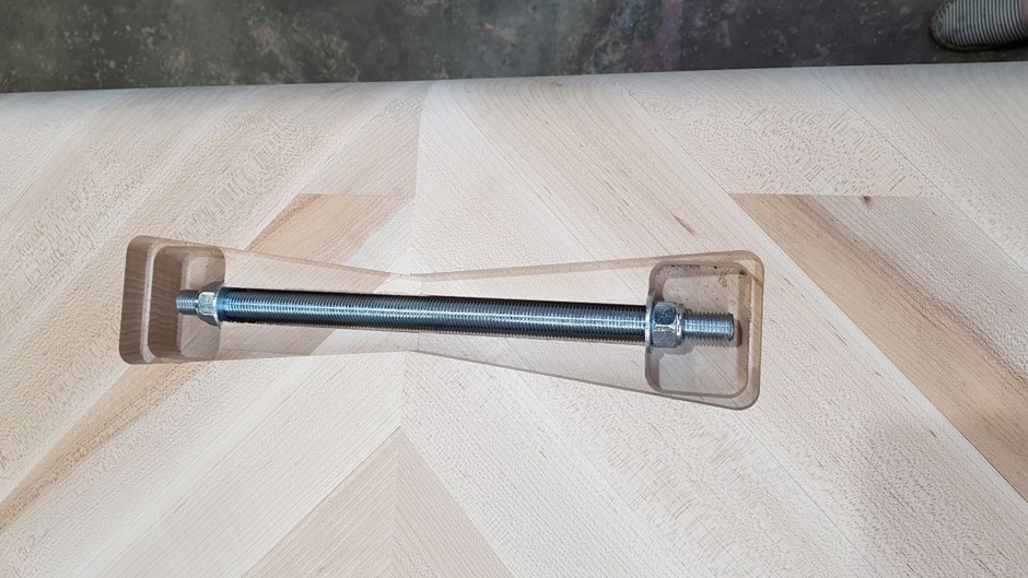 “Bow” shaped removable caps concealing hardware for fine tune adjustment on site.