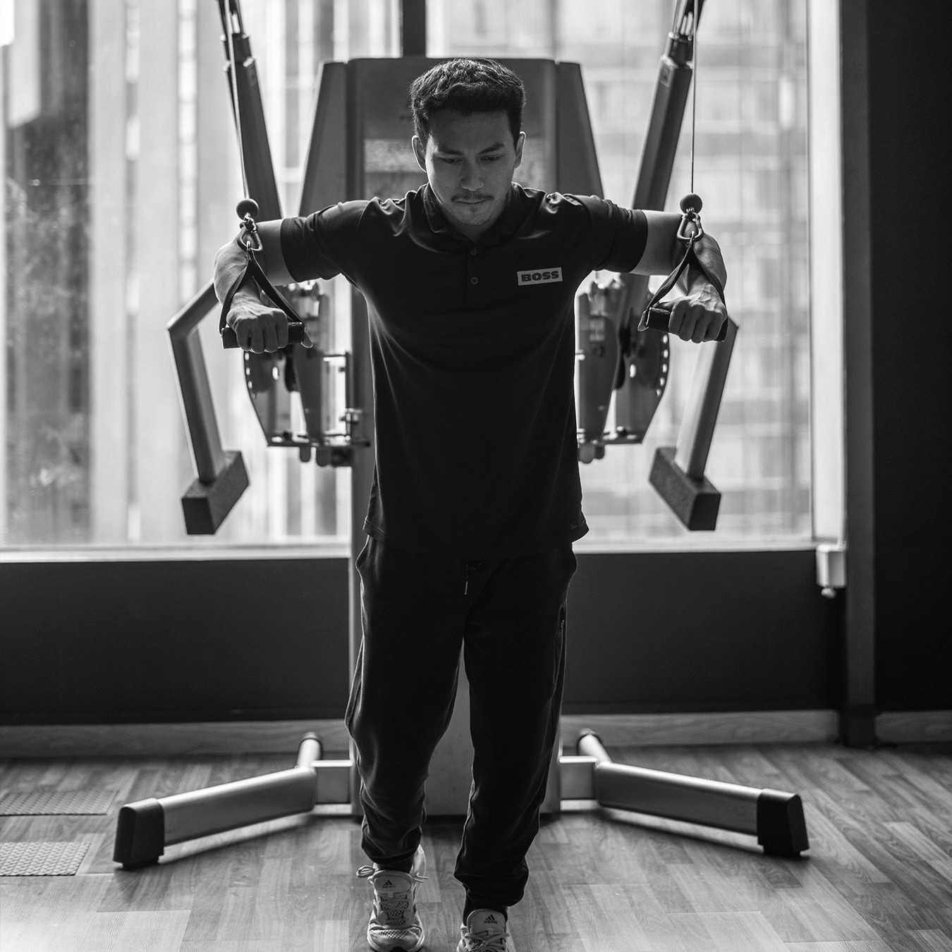 Man Using A Cable Machine