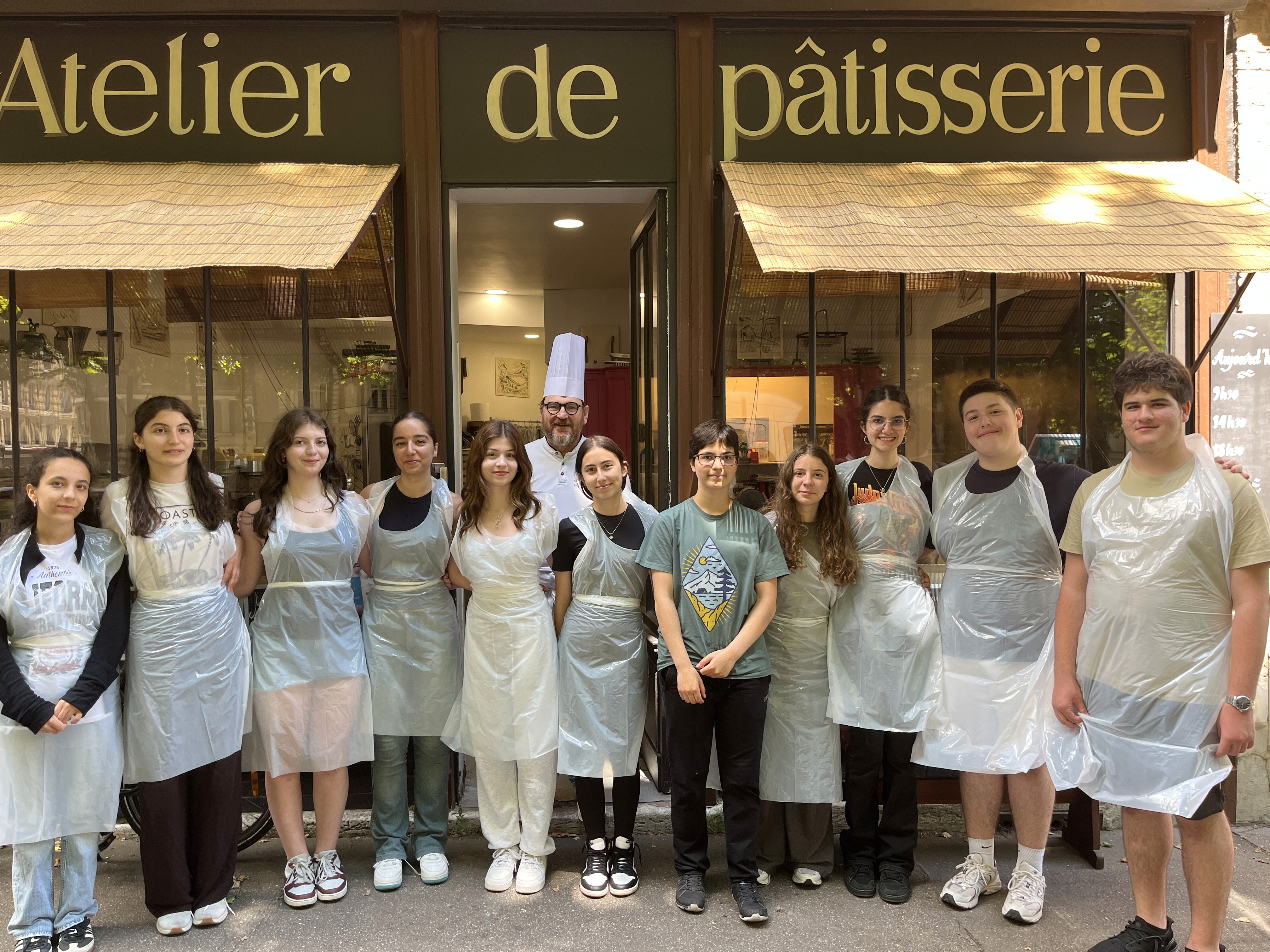 a man walking down a road next to a body of water