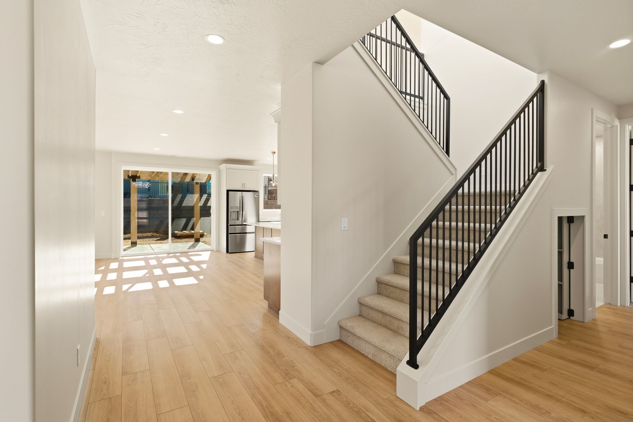 Staircase in The View at Falcon Ridge in Hurricane, Utah, leading to upstairs living areas and flex spaces.