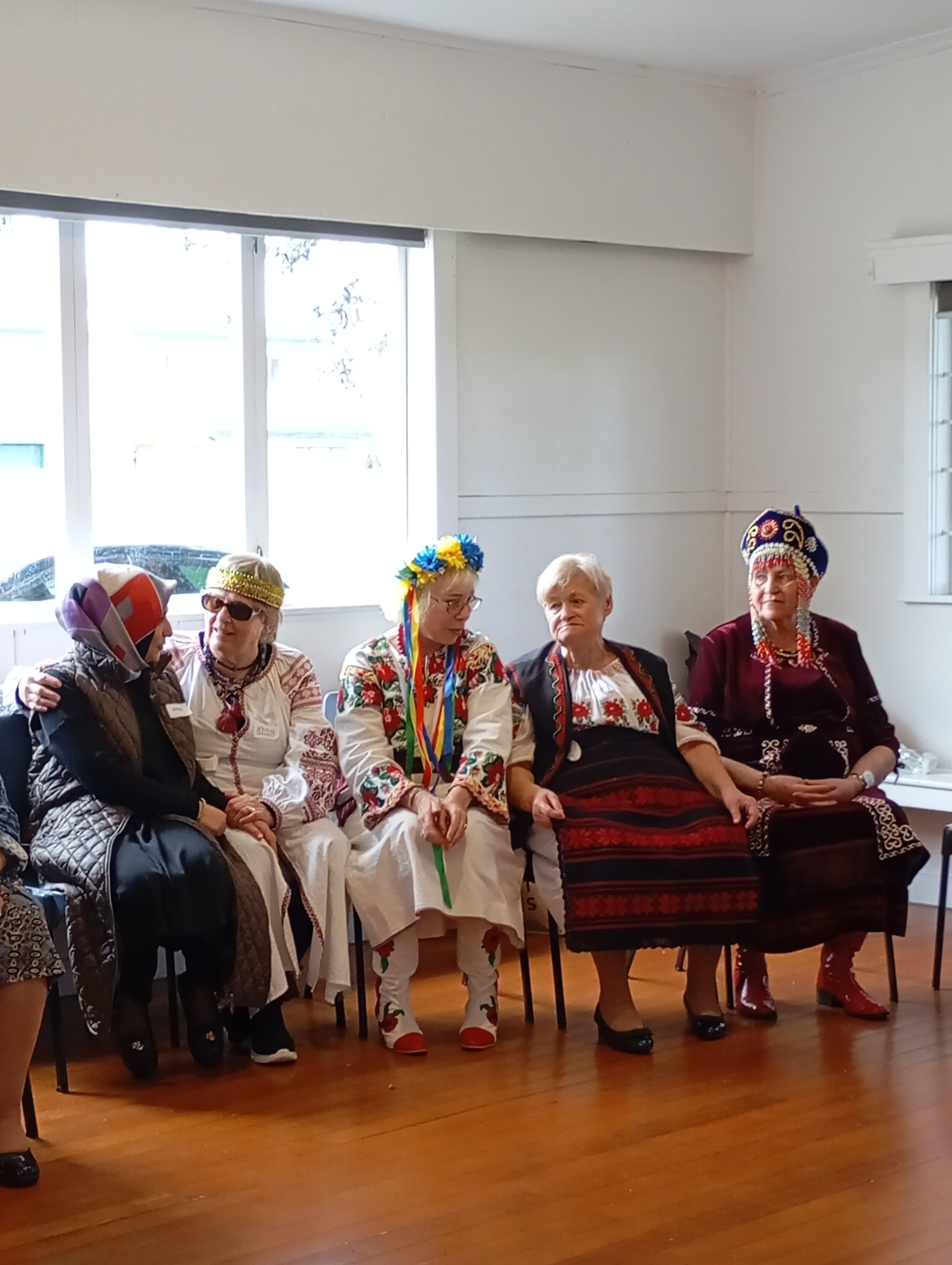 four person holding each others waist at daytime