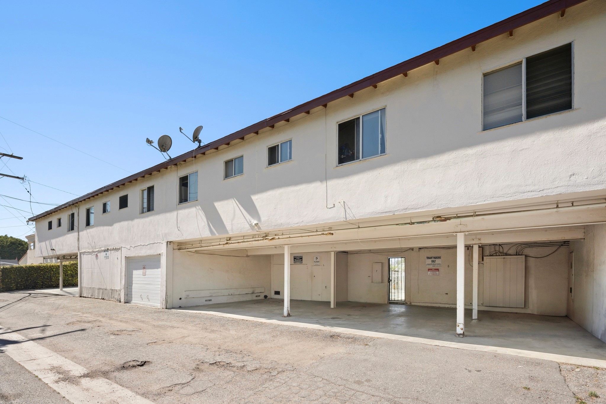 Rear exterior with covered parking and building footprint at 11178 Culver Blvd.
