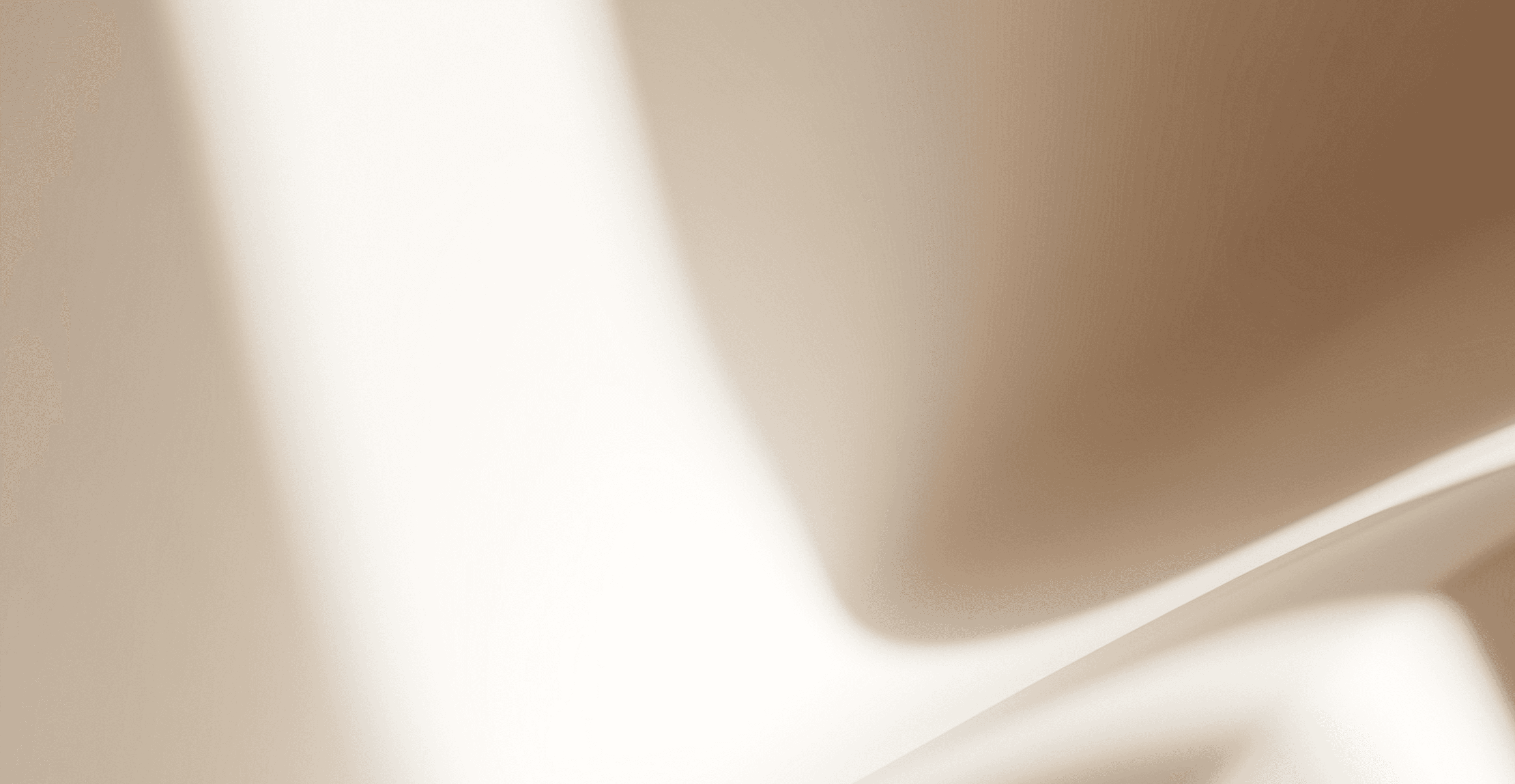 Close-up of a white chair featuring a gracefully curved backrest, highlighting its elegant design and smooth finish.