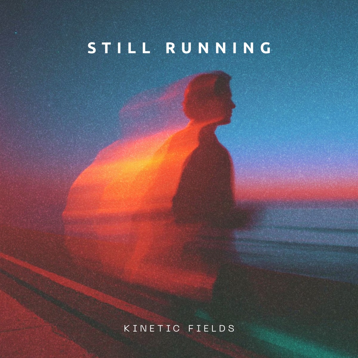 A close-up of a pink cocktail in a martini glass, set against a nighttime background with soft, blurred colors.