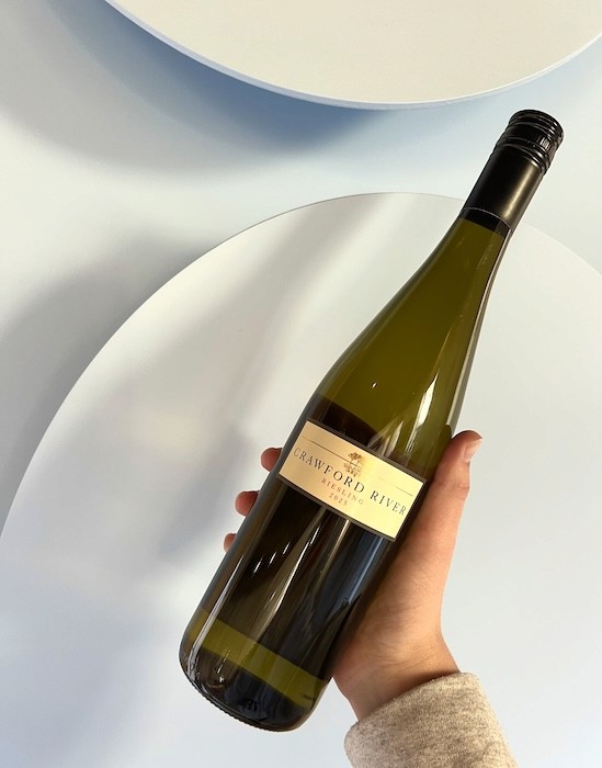 Hand holding bottle of Crawford River riesling