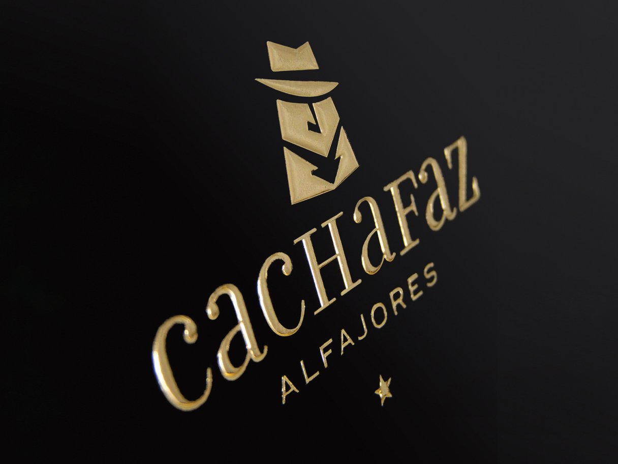 Rustic cabin in a golden field at sunset