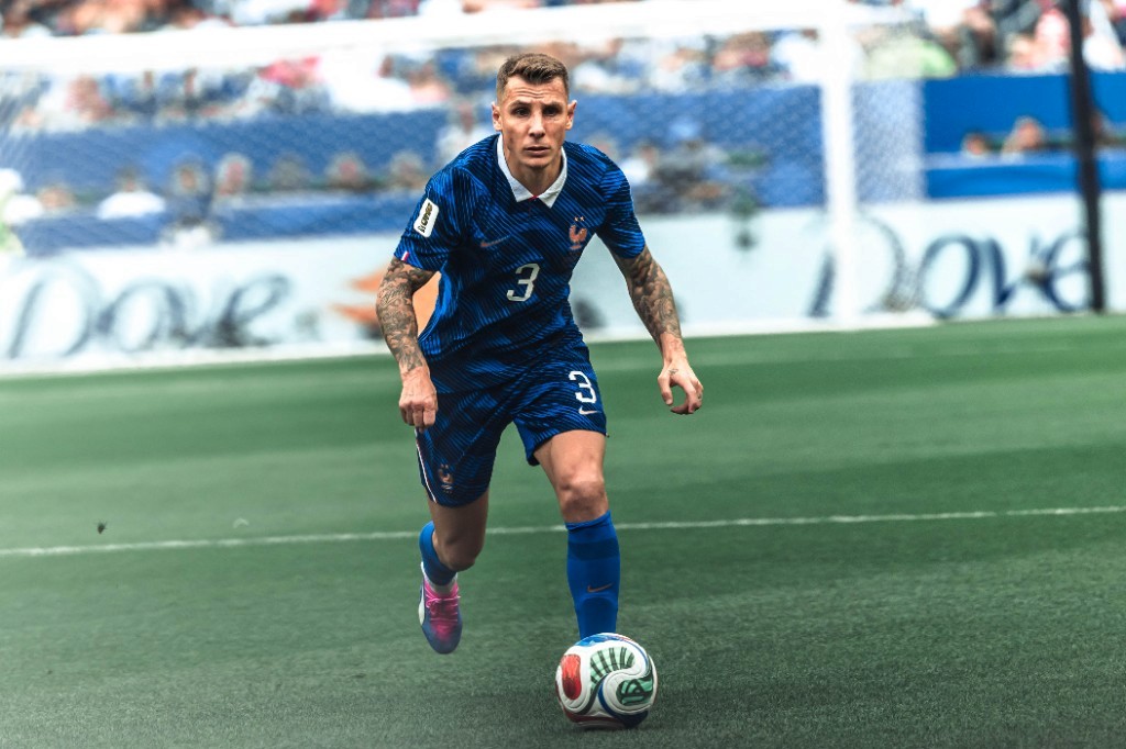 France's Lucas Digne dribbles near goal during the 2026 World Cup group-stage match against Iraq