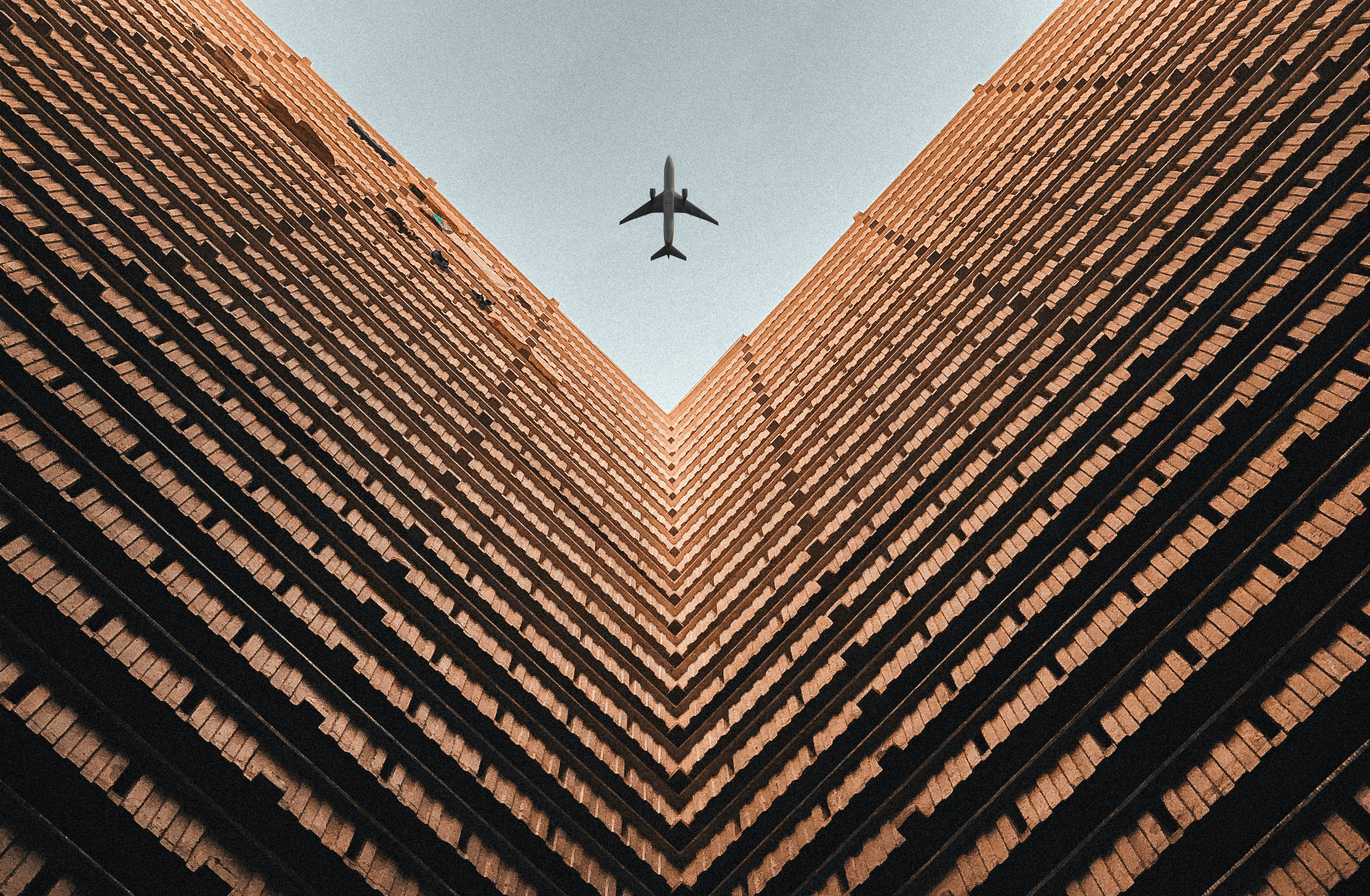 worm view photo of brown building during daytime