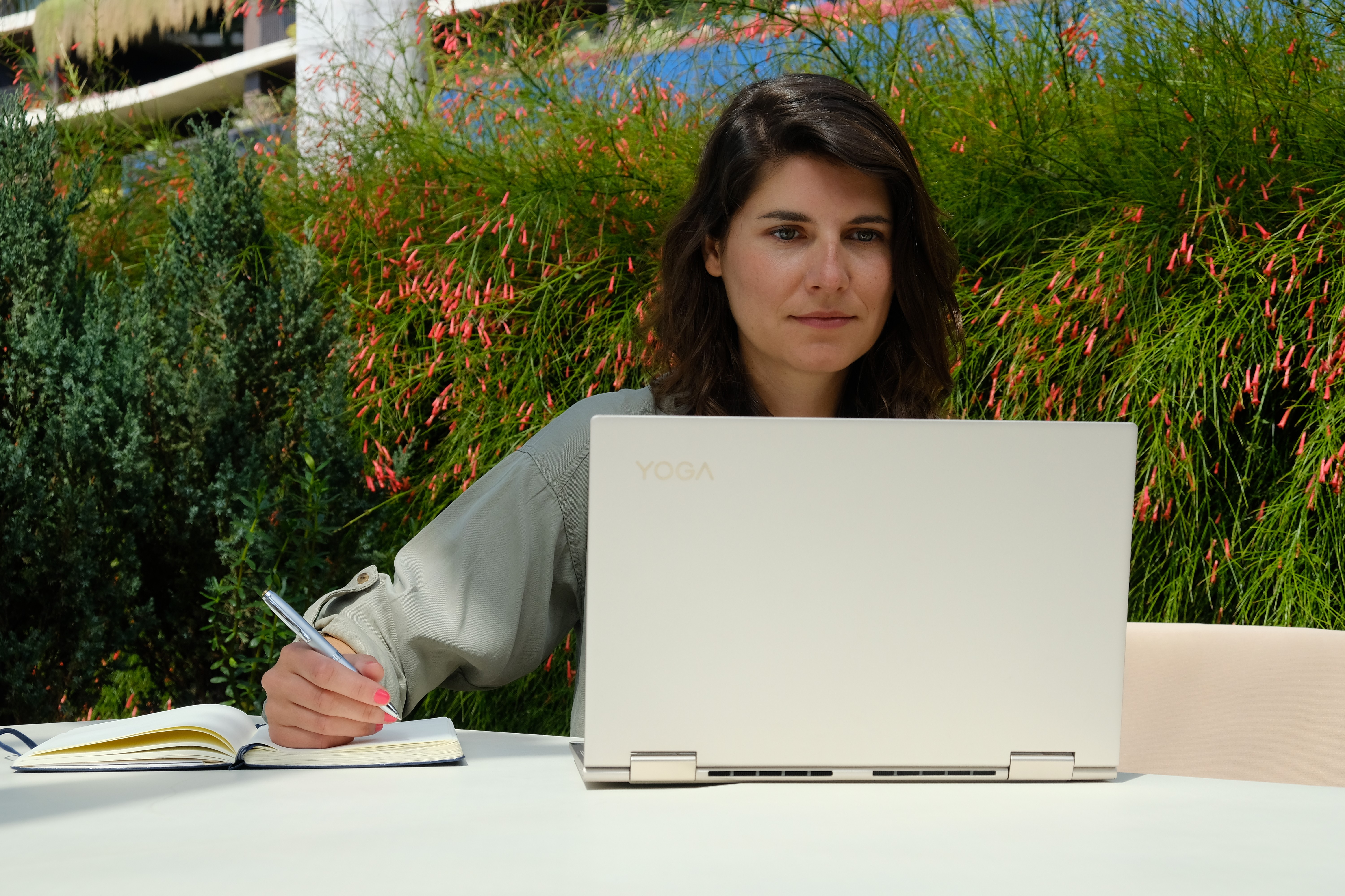 Diana Grobelny planning agency workflows at her laptop