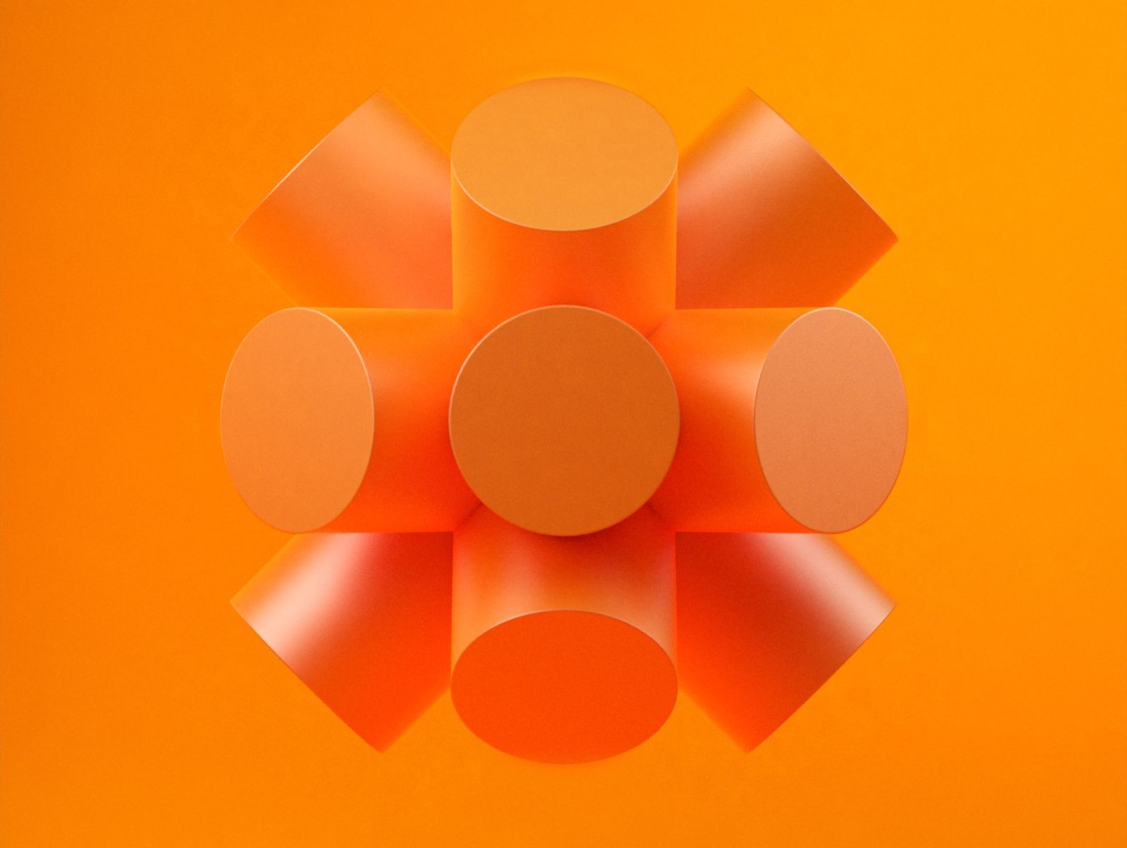 Team collaborating around desk with devices representing UI UX strategy