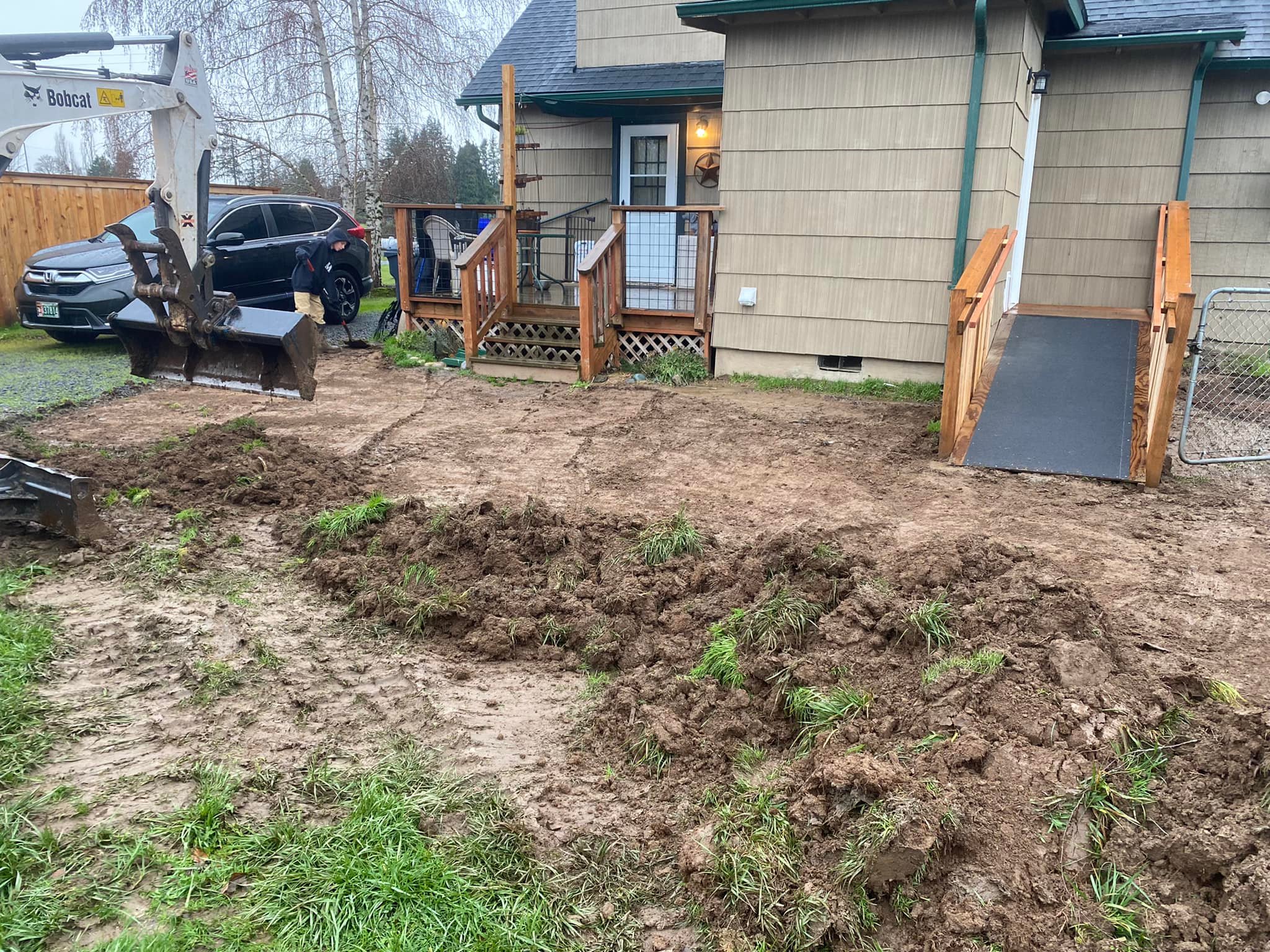 Cleared land in front of house for site preparation in Oregon City