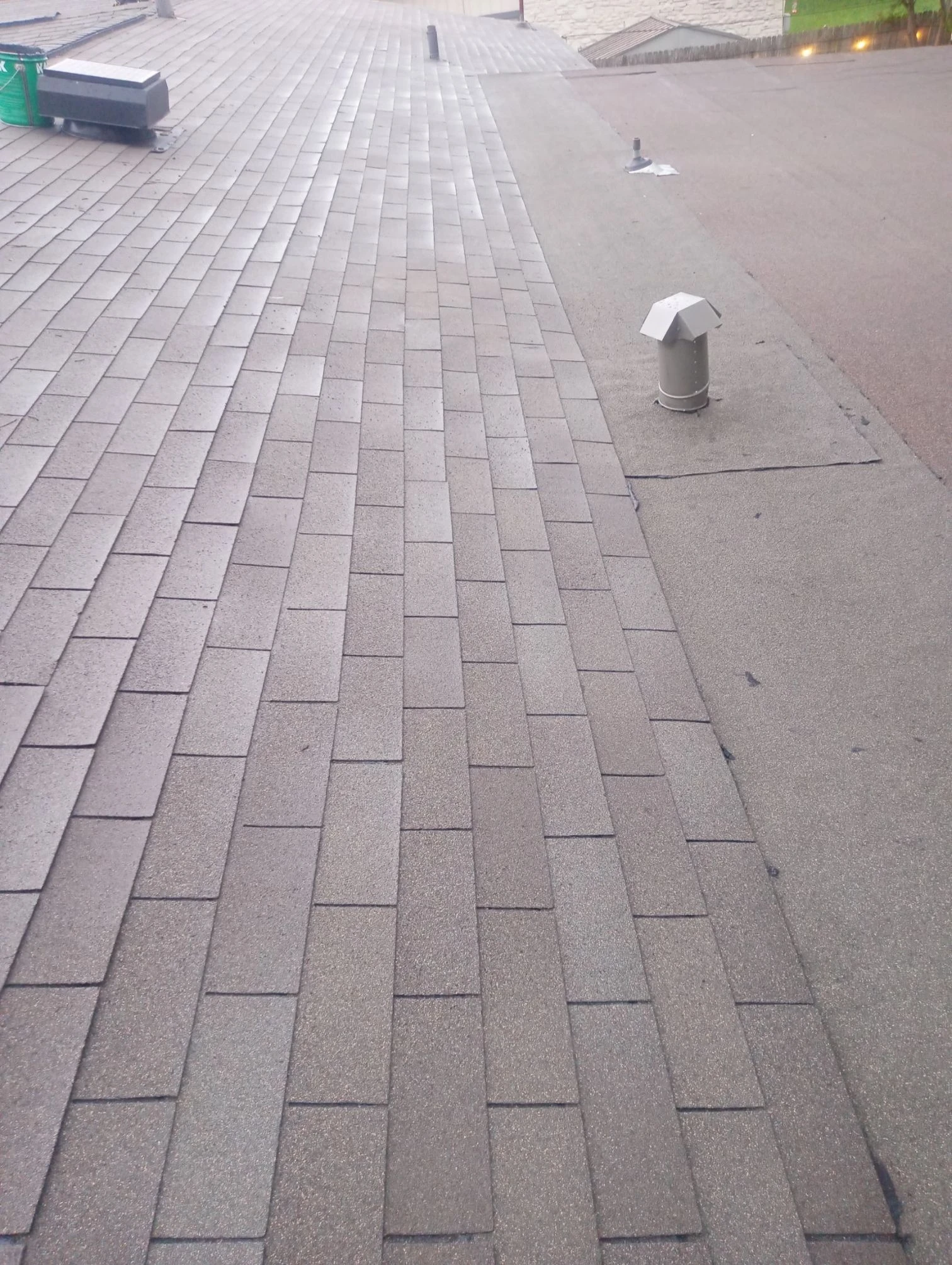 Finished repair: shingle-to-flat-roof transition repair in Universal City, Texas.