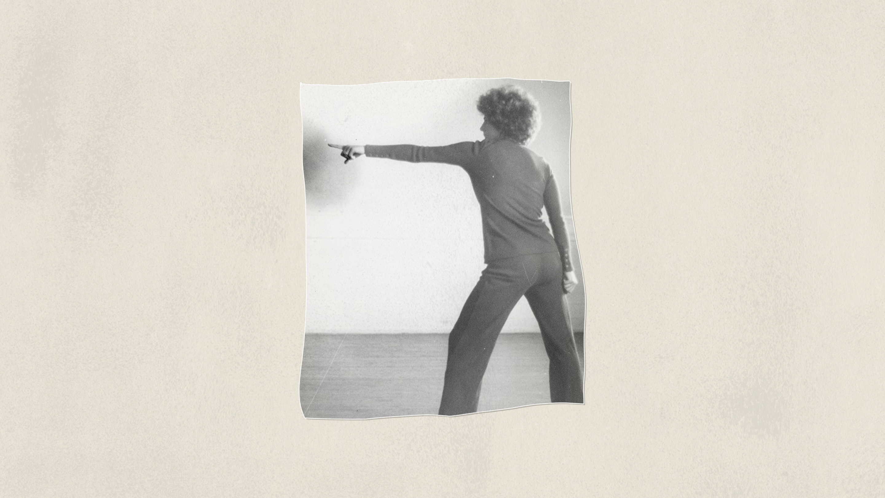 Black-and-white photo of a person pointing forward, symbolizing direction and uncertainty in the PhD journey