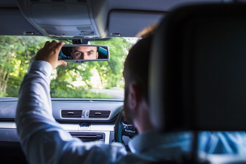 https://nybooking-production.s3.amazonaws.com/uploads/blog/avatar/2343/man-sitting-inside-car-adjusting-rear-view-mirror_23-2147841919.jpg