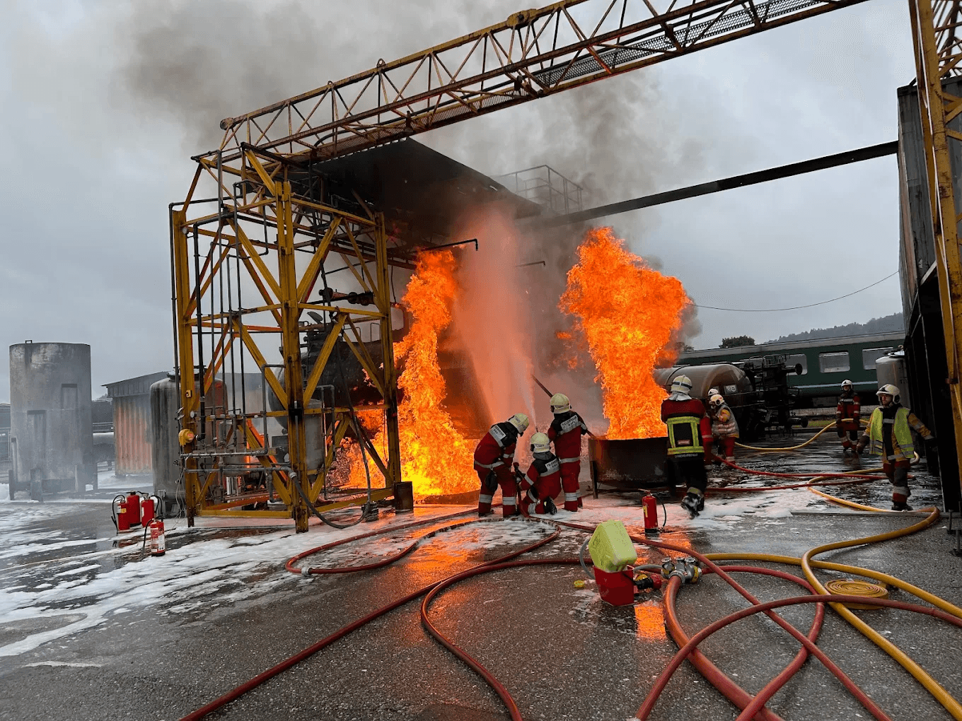 Black and white image of people working at a table with laptops, showing hands gesturing during discussion of digital content displayed on screens, with fabrica® logo in the corner.
