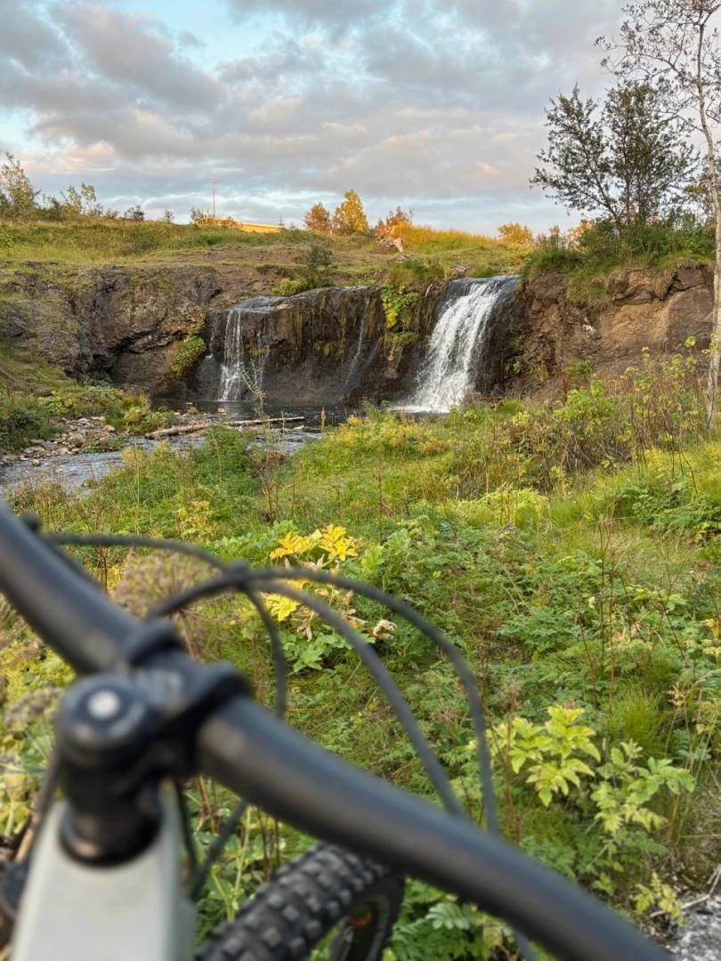 view from bike of a waterfall