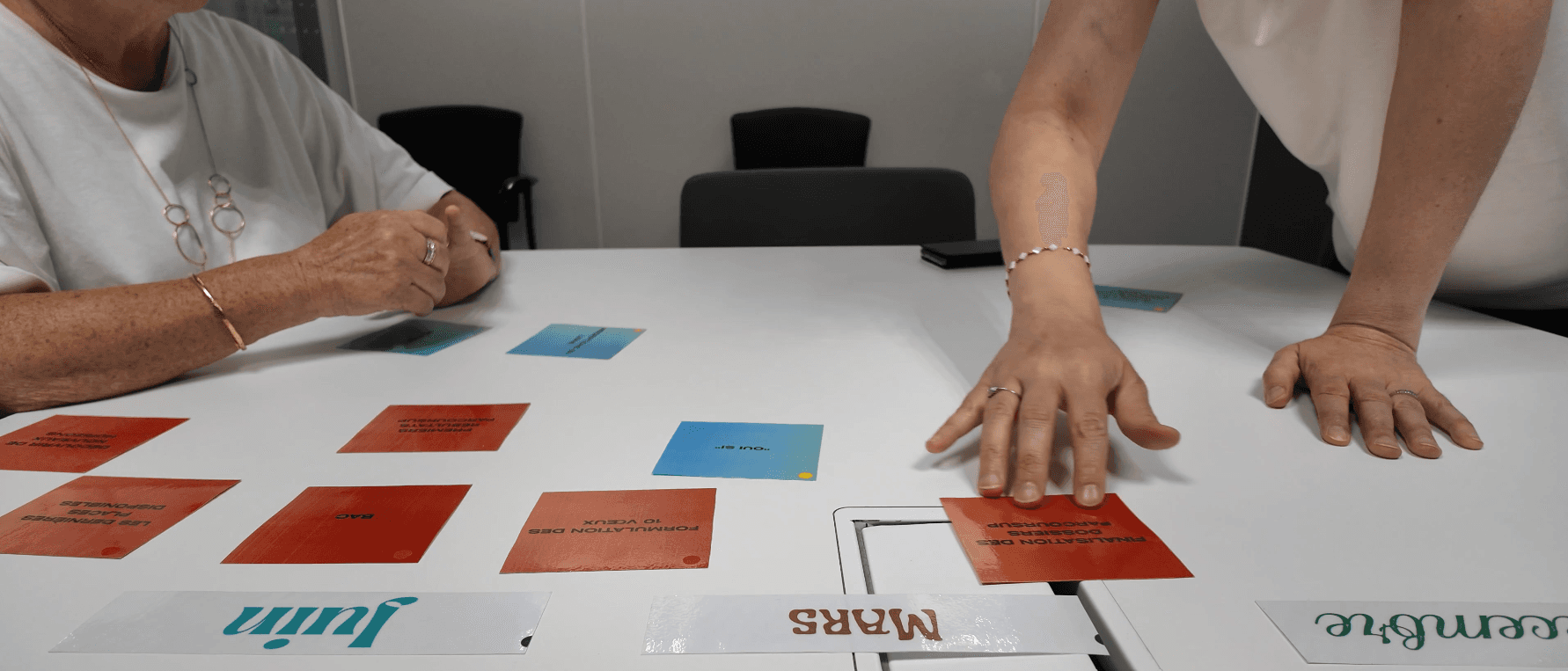 woman carrying white and green textbook