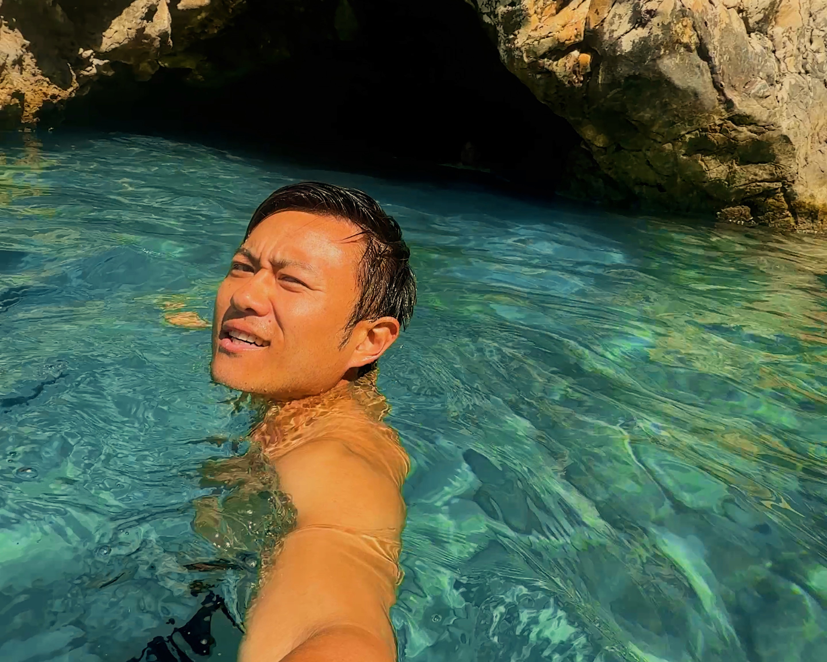 Swimming toward the entrance of the cave