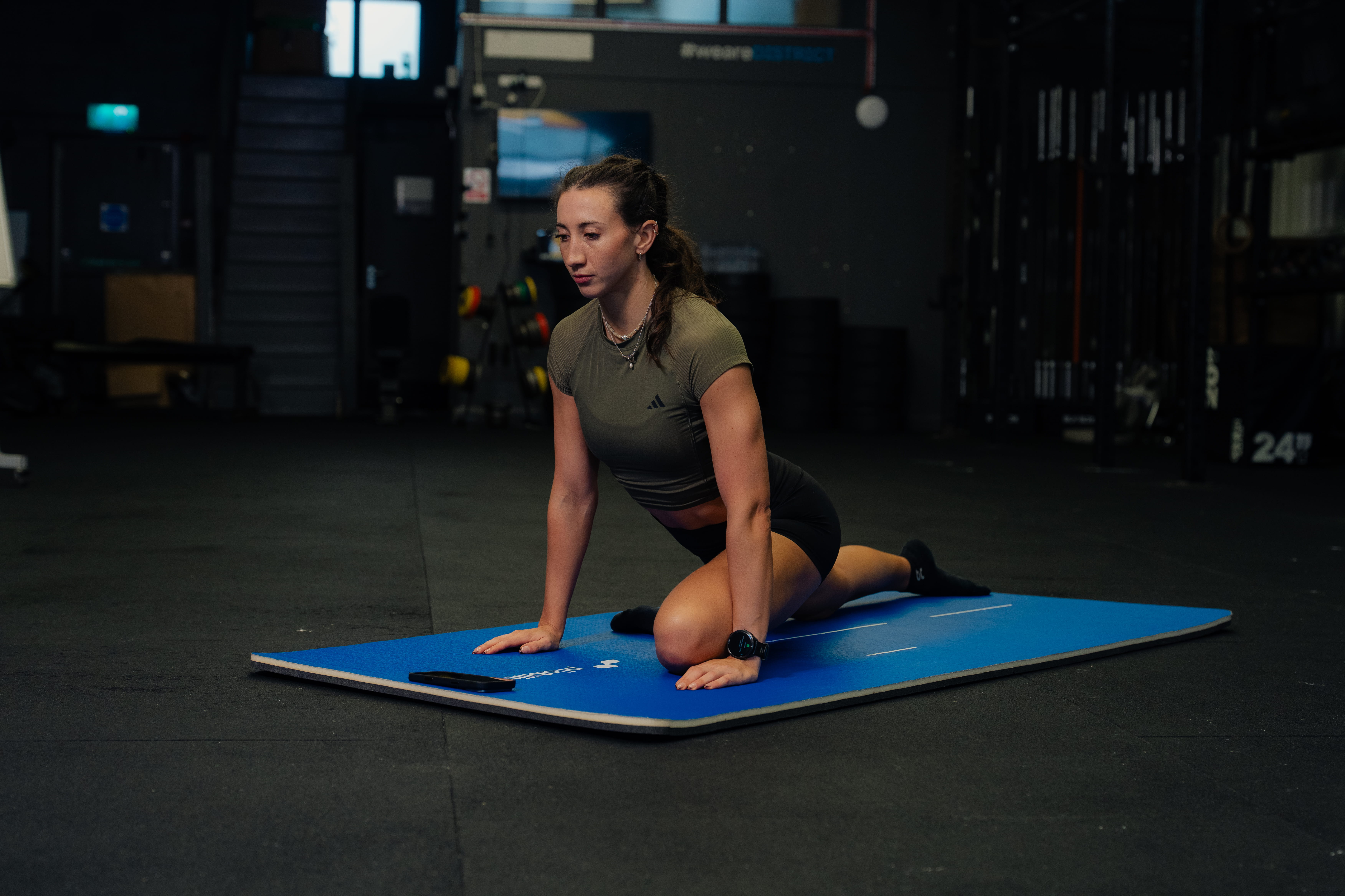 person on mat in gym - Thumb Stiffness and Locking