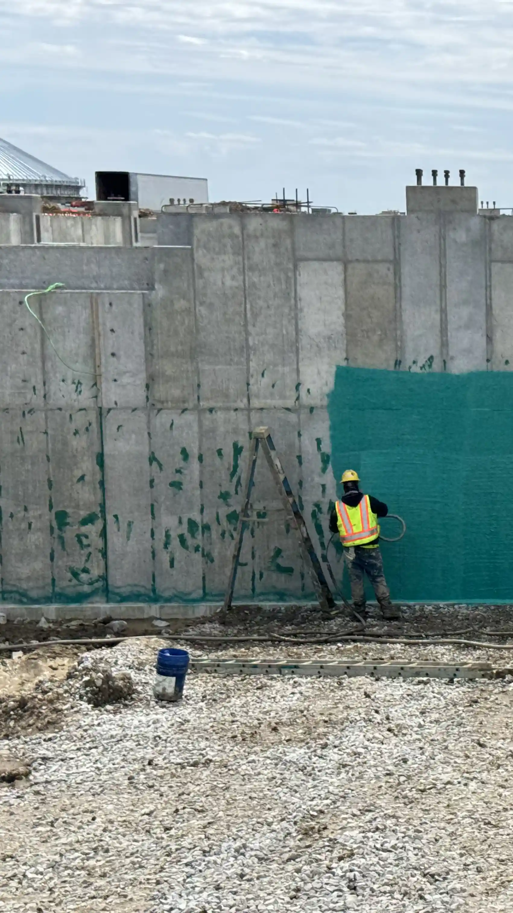 A foundation that has been pre-treated with Rub-R-Patch waterproofing putty as a crack filler