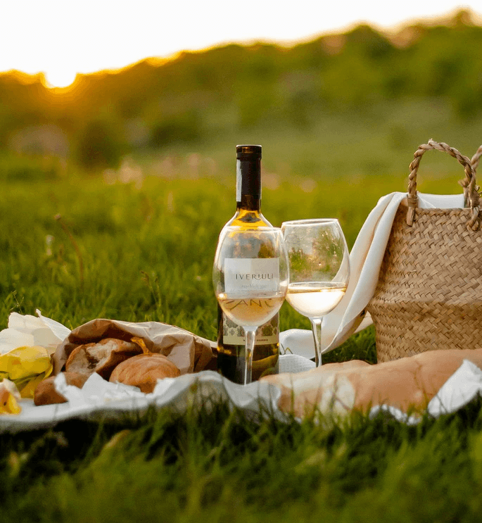 clear glass bottle on brown wooden table during daytime