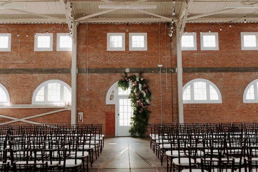 Brick wedding venue in Liberty Station San Diego with exposed brick walls and vaulted ceiling interior