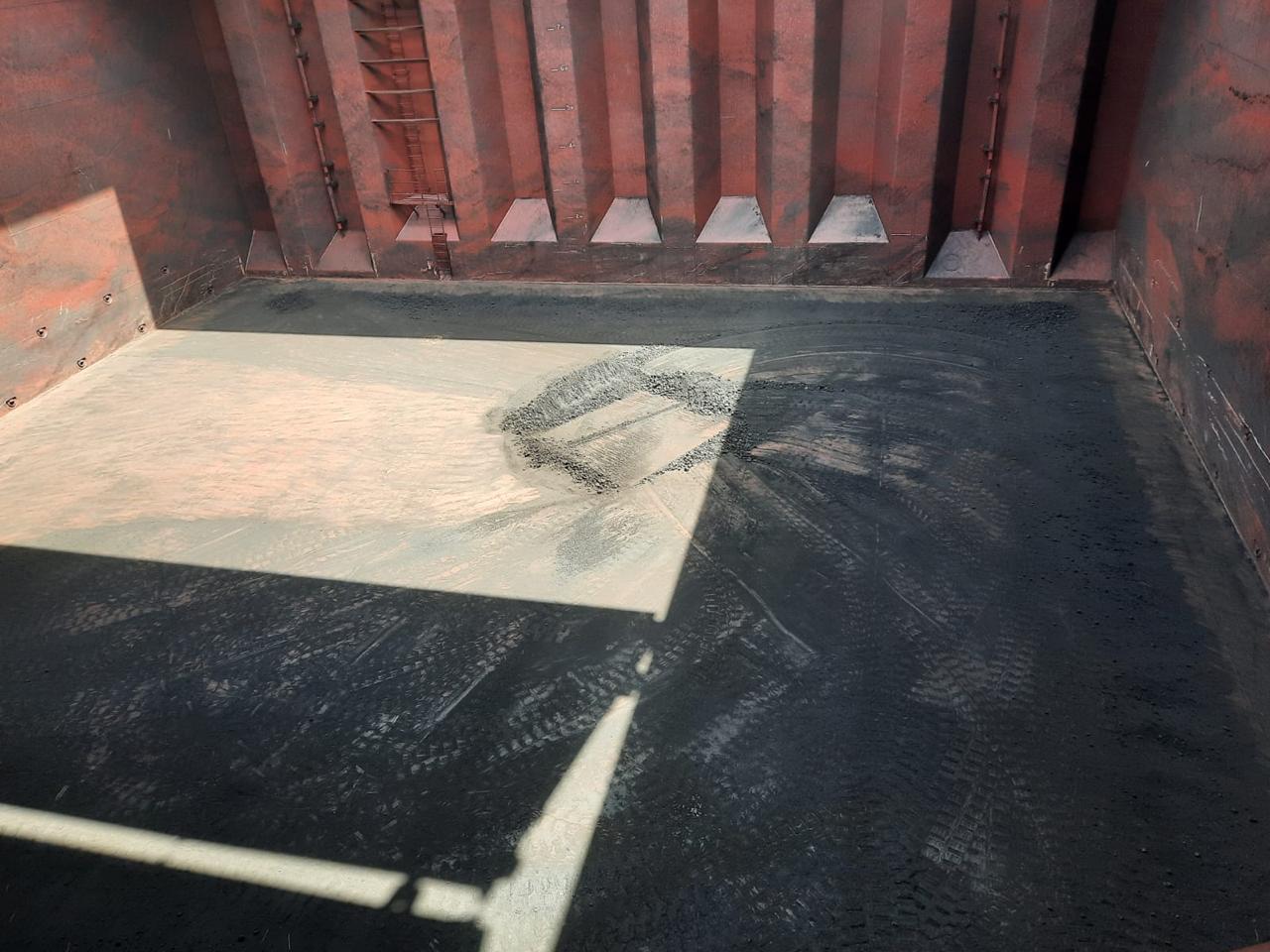 a good view of a cargo hold box shaped dirty with coal