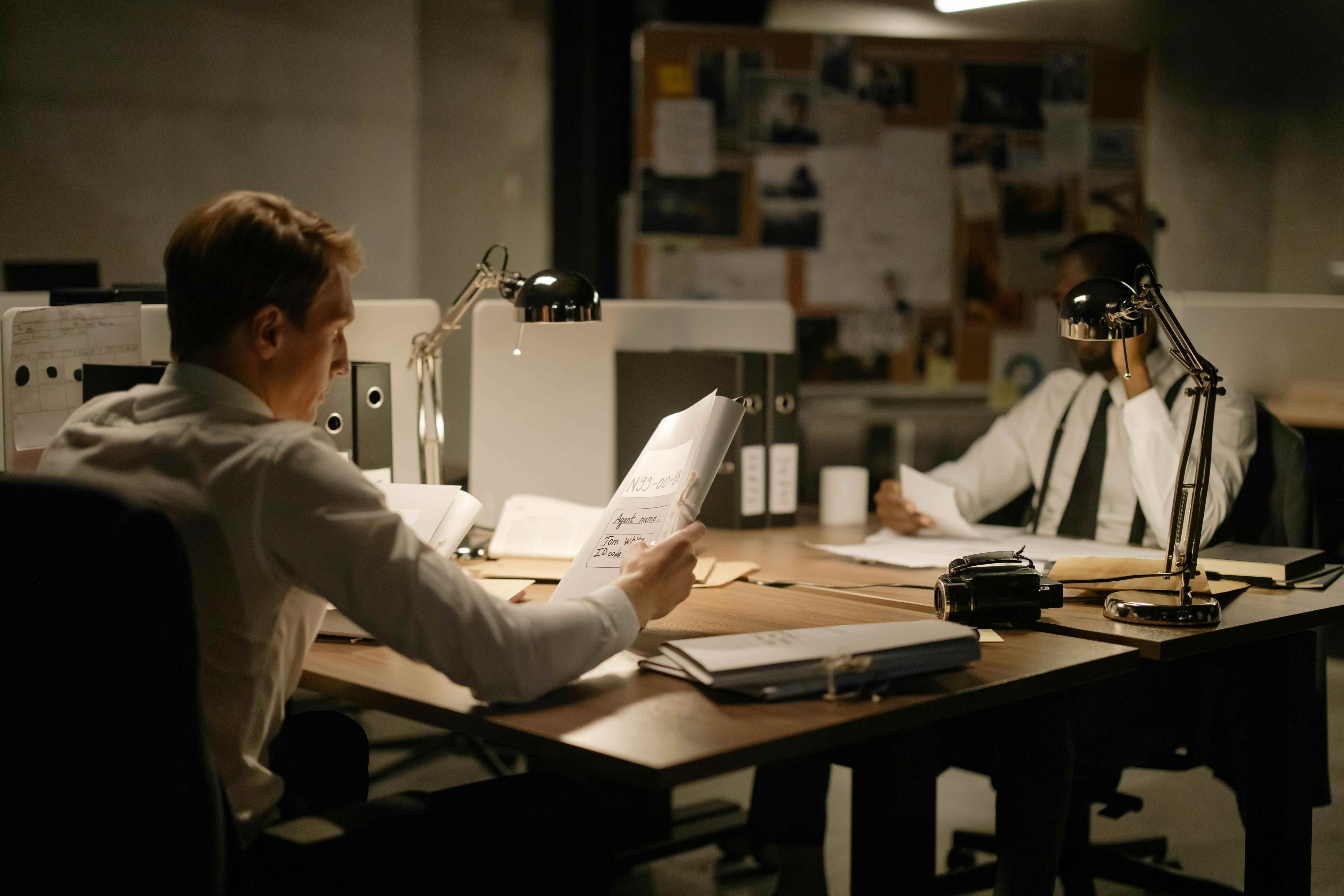 Lawyers reviewing documents during the criminal investigation process