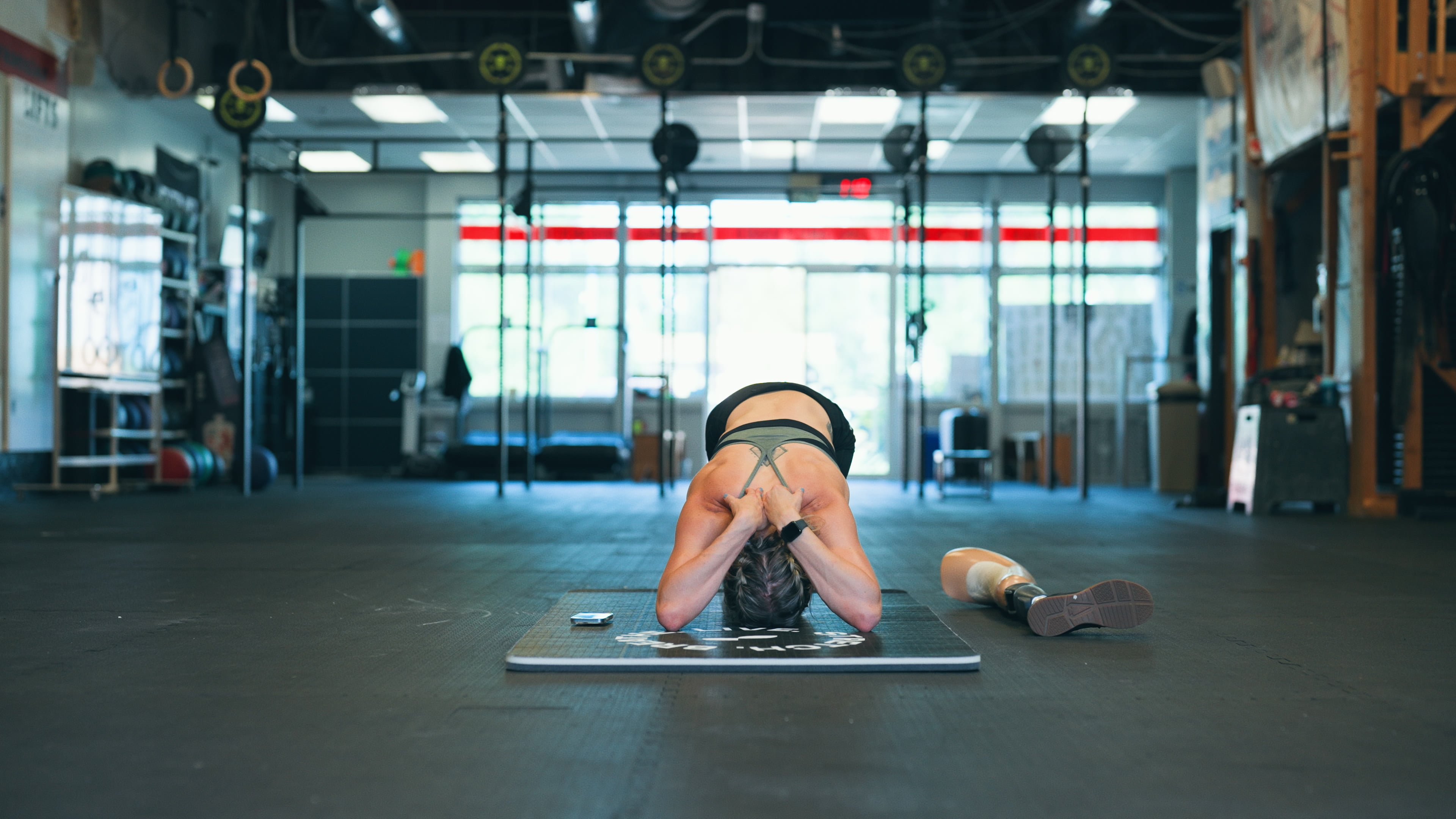 Woman Stretching in Gym - Back Mobility Exercises