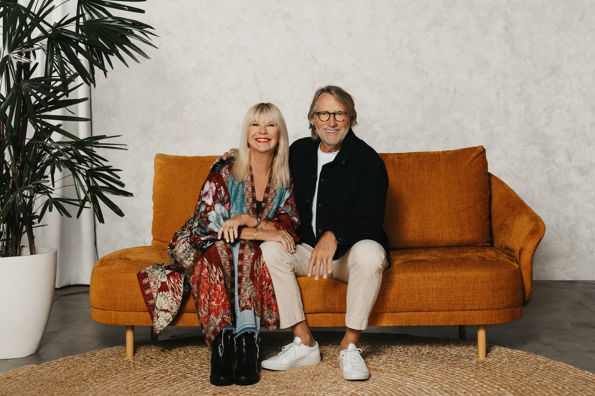 a man and a woman standing in a field