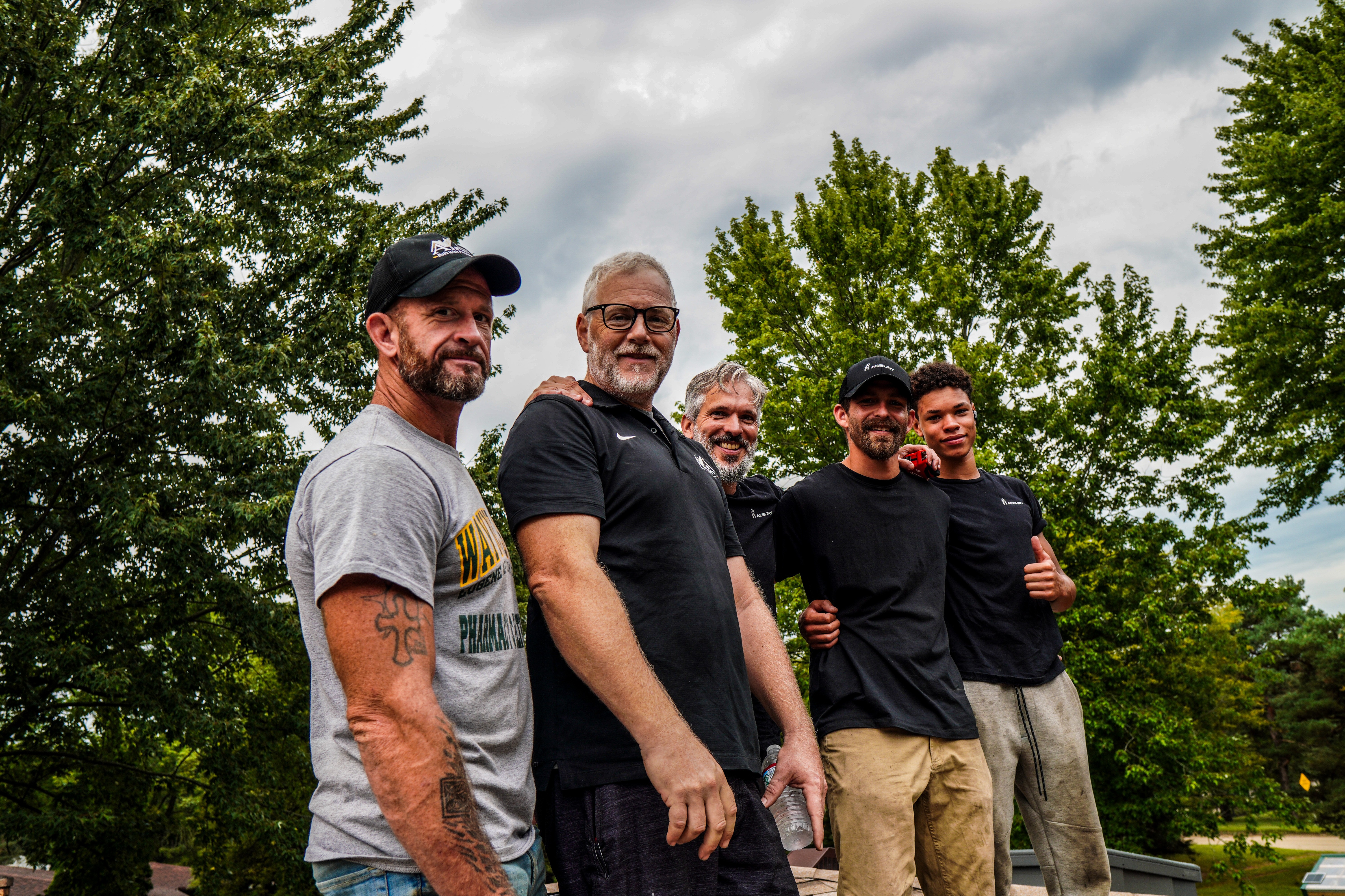Asbury Roofing & Solar team at a job site
