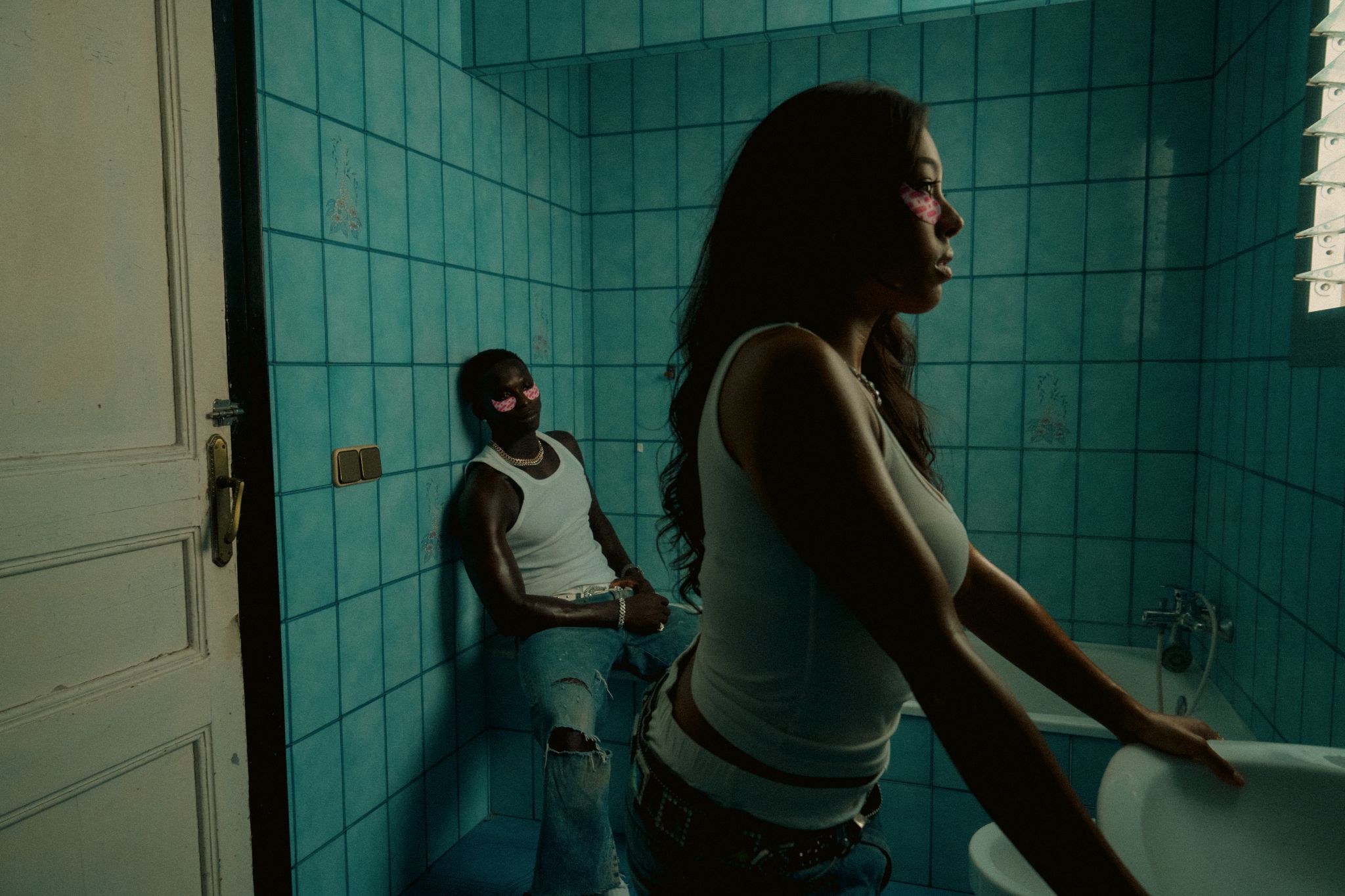 Streetside billboard with flyposters of the Batch.Works brand and illustrations