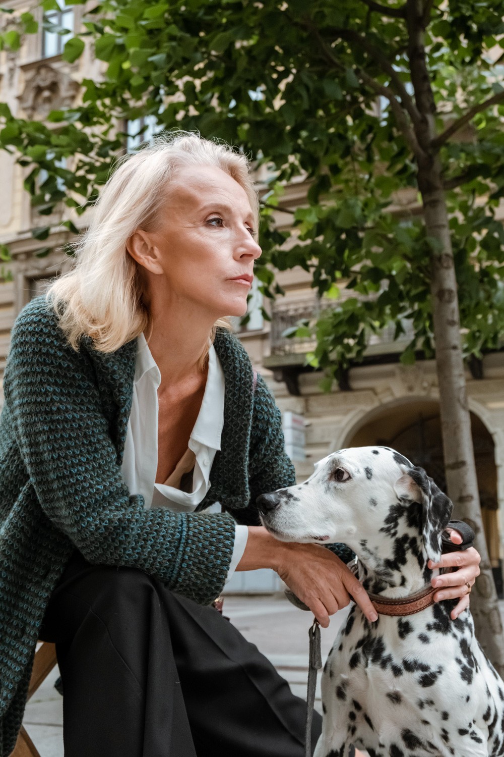 Woman posing with her dalmatian