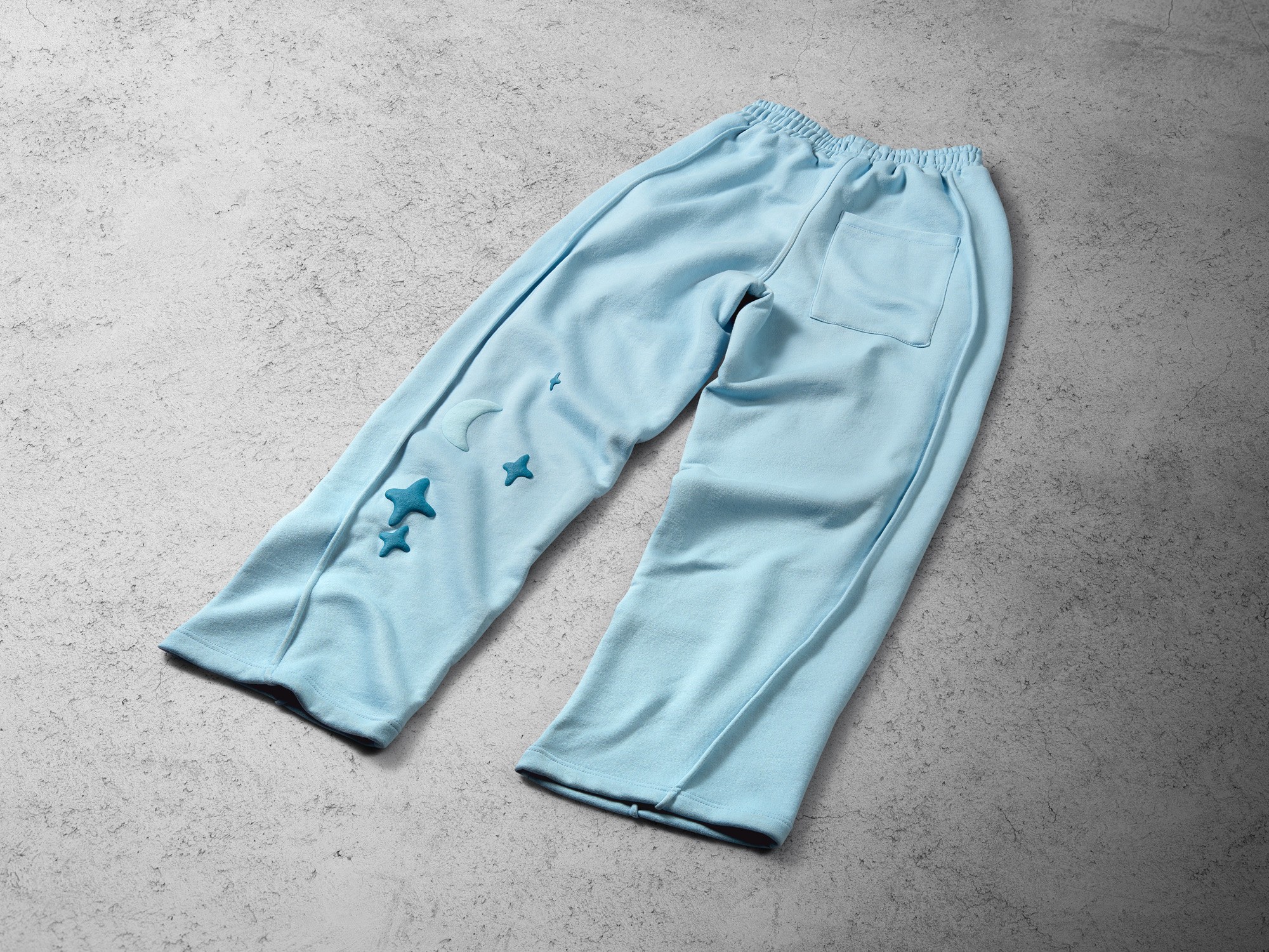 Tuko Clothing blue Dandadan inspired joggers photographer by Matthew Brown (London product photographer).
