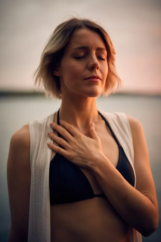 Woman outdoors with her eyes closed