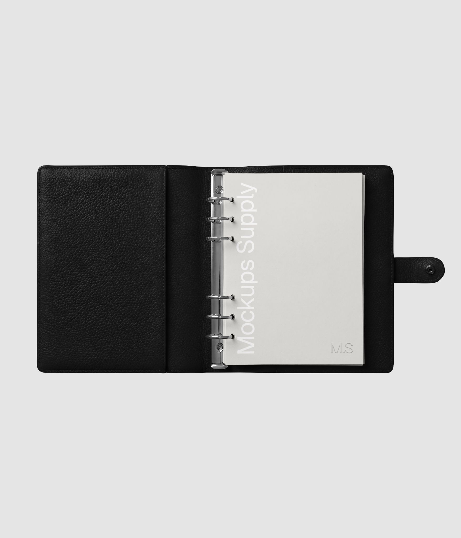 Top down view of an open leather journal mockup featuring a single page layout