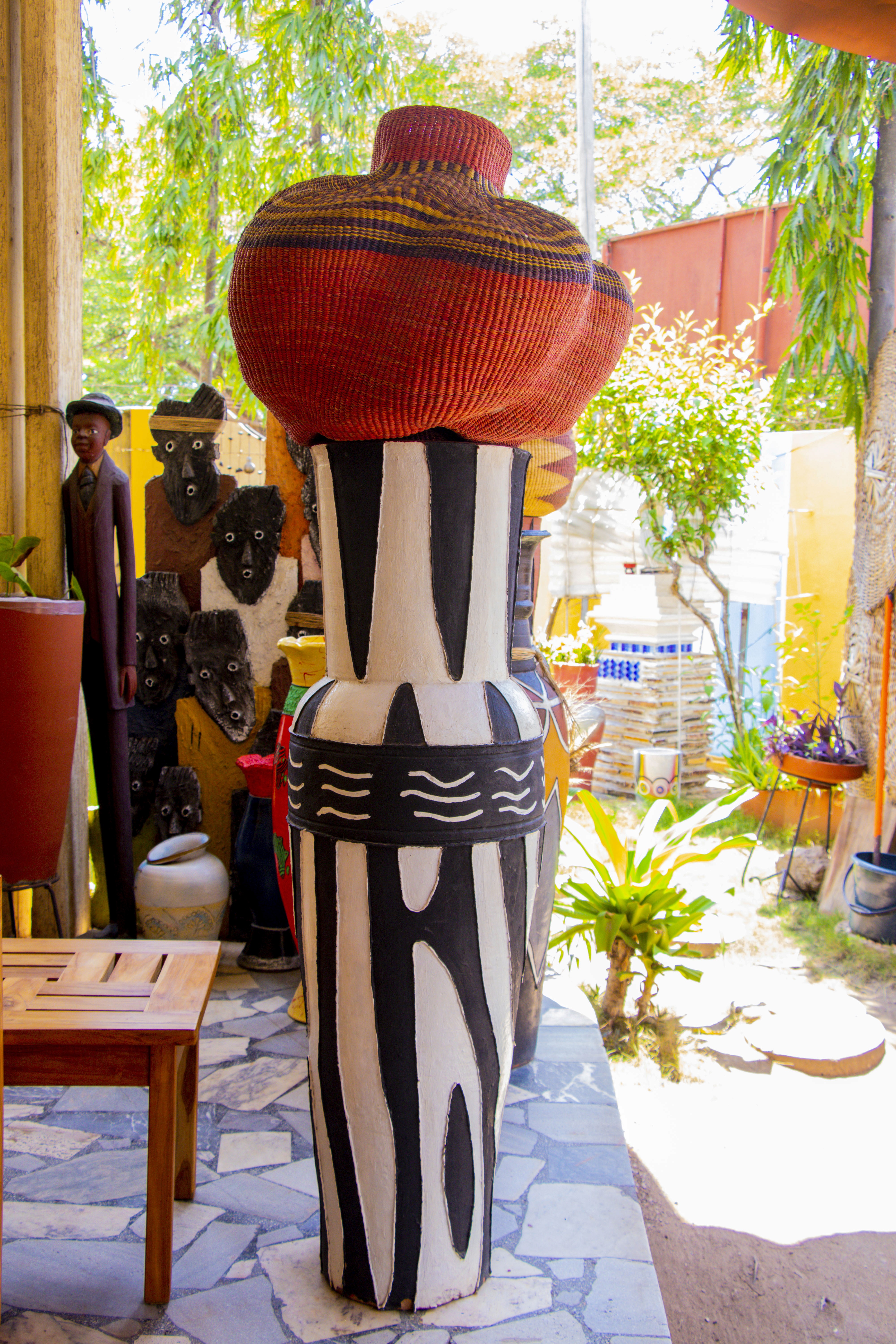 a number of paintings on a wall near one another