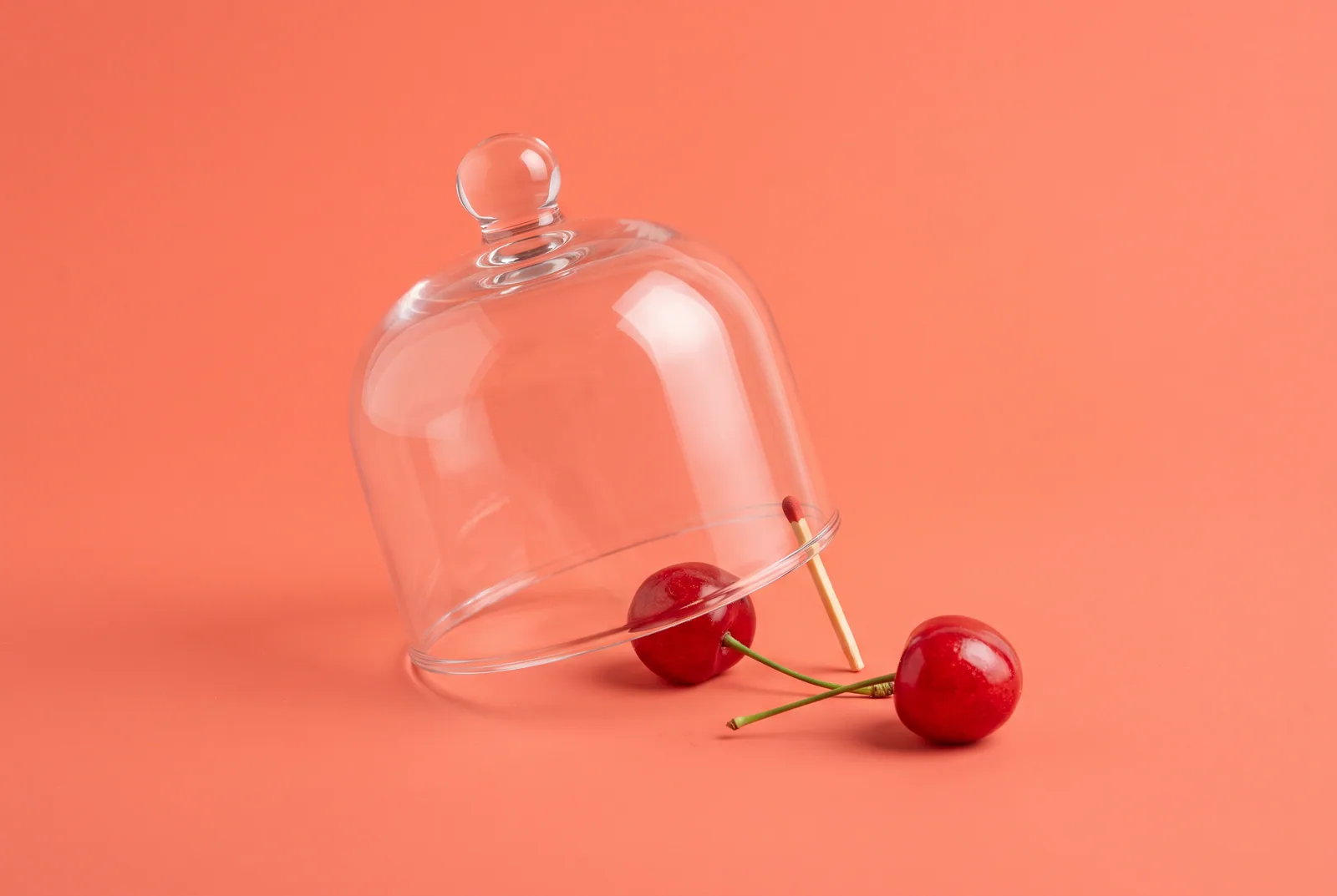 Cherries rolling out through a narrow gap under a tilted glass cloche, the loopholes that undo a permanent porn blocker on a phone