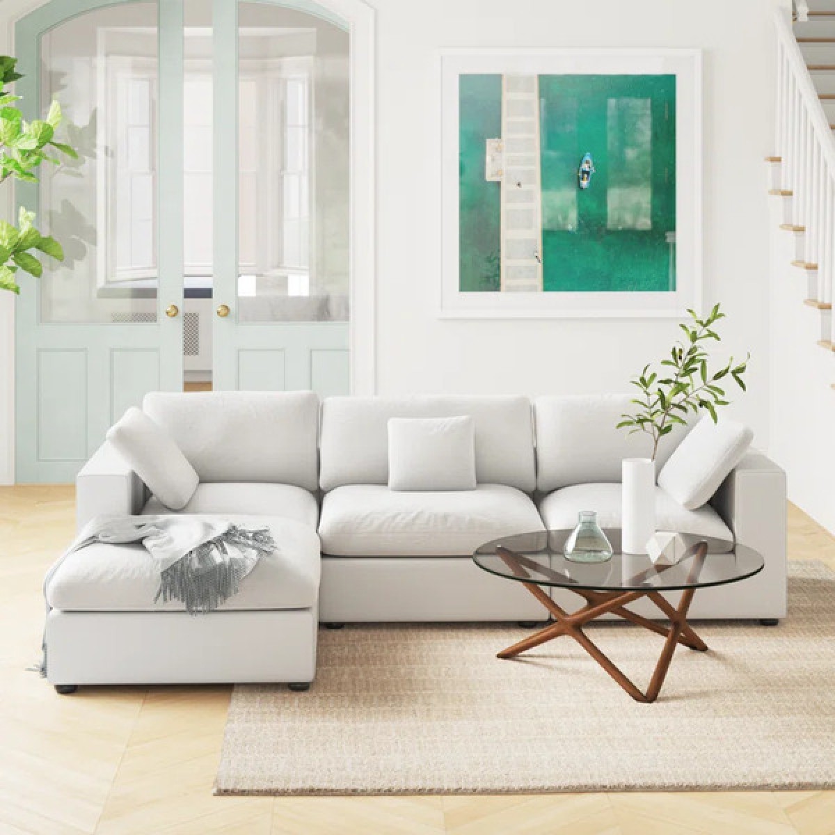 Logan Askari Feather Down Cozy Cloud Couch in a bright living room with modern decor and a glass coffee table