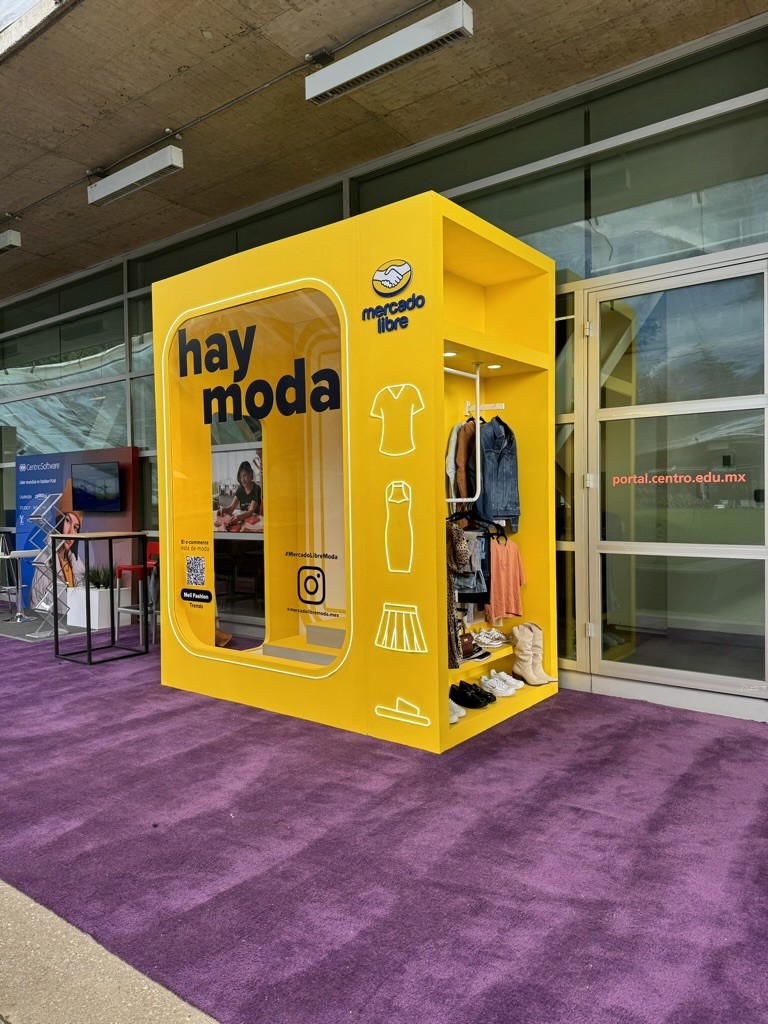 A man stading with Surfboard