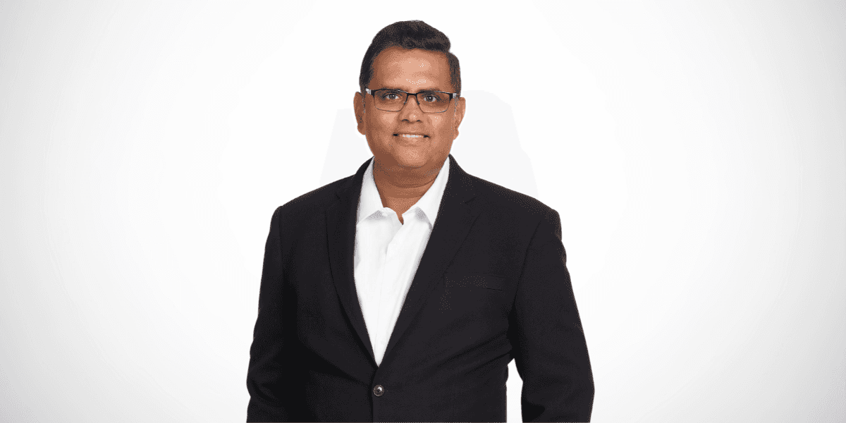 Sesh Iyer, founder of Riga Business Coaching, in a professional business portrait.