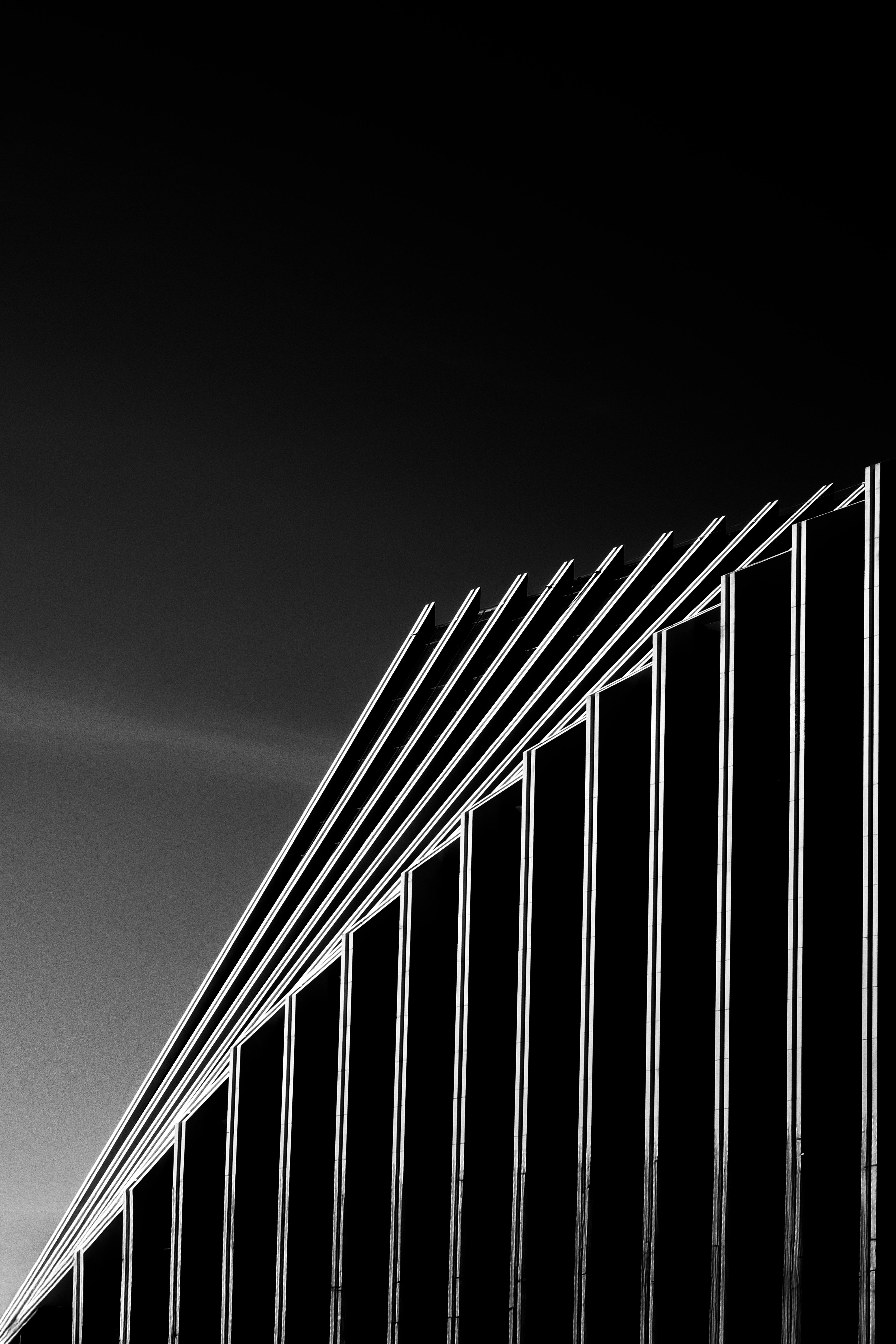 A dark themed sky with building shapes.