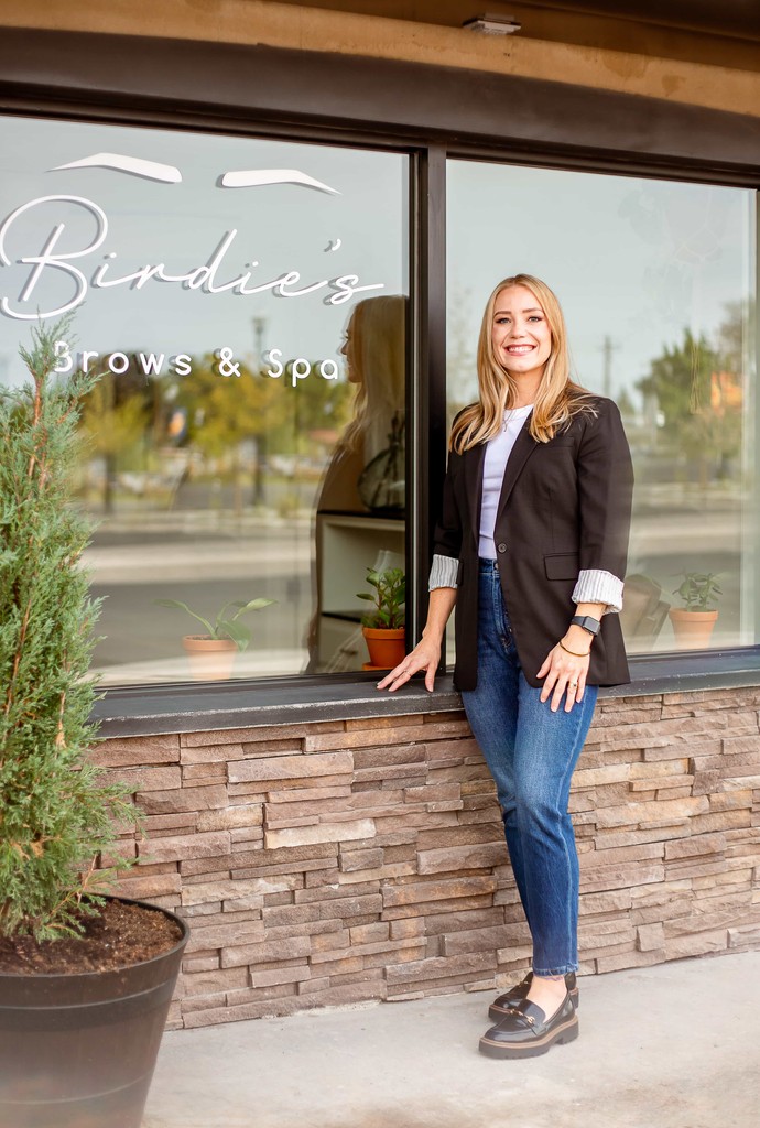 Laurie Rogers standing in front of Birdie's Brows & Med Spa